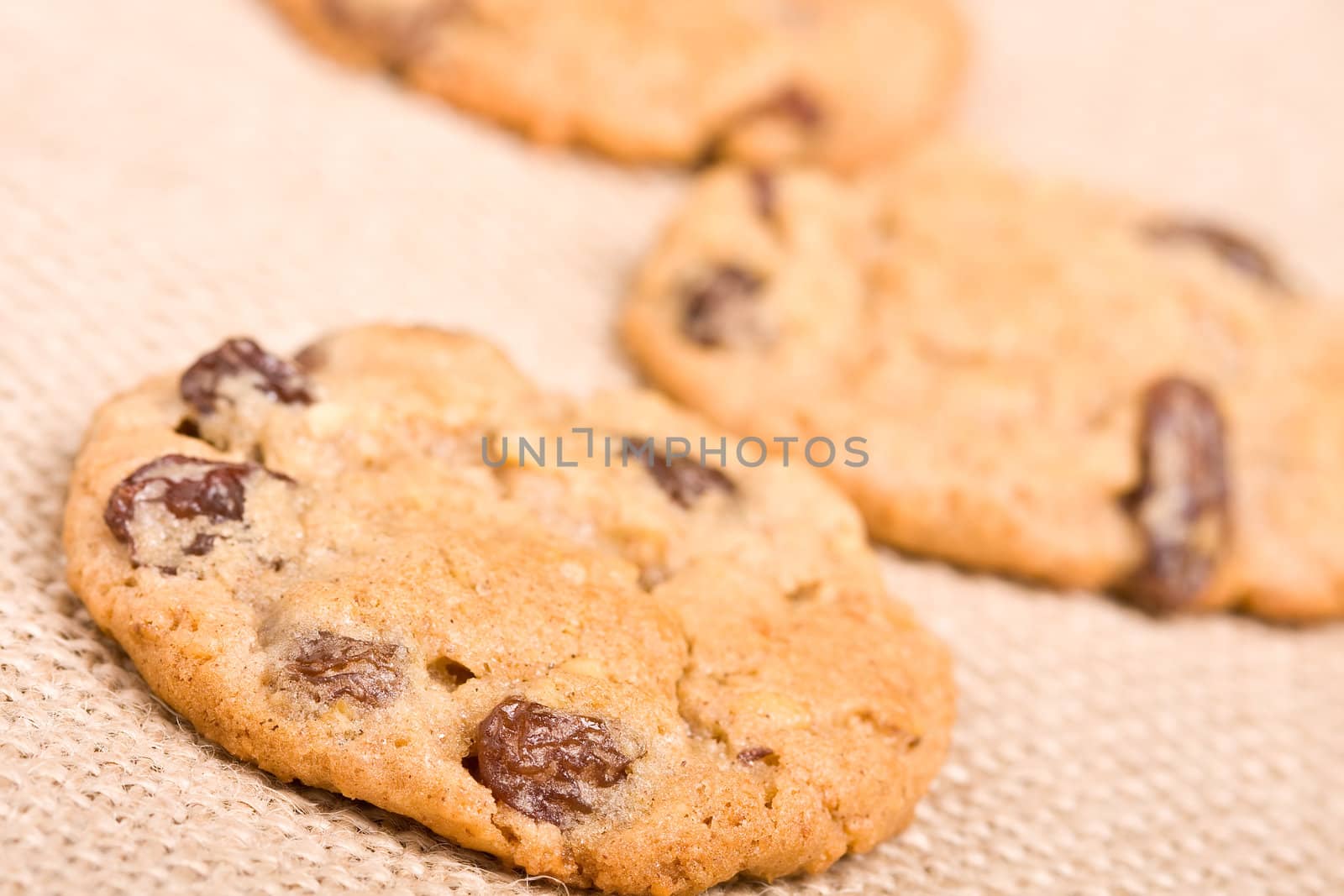 oatmeal raisin cookies on a burlap background macro fresh out of the oven