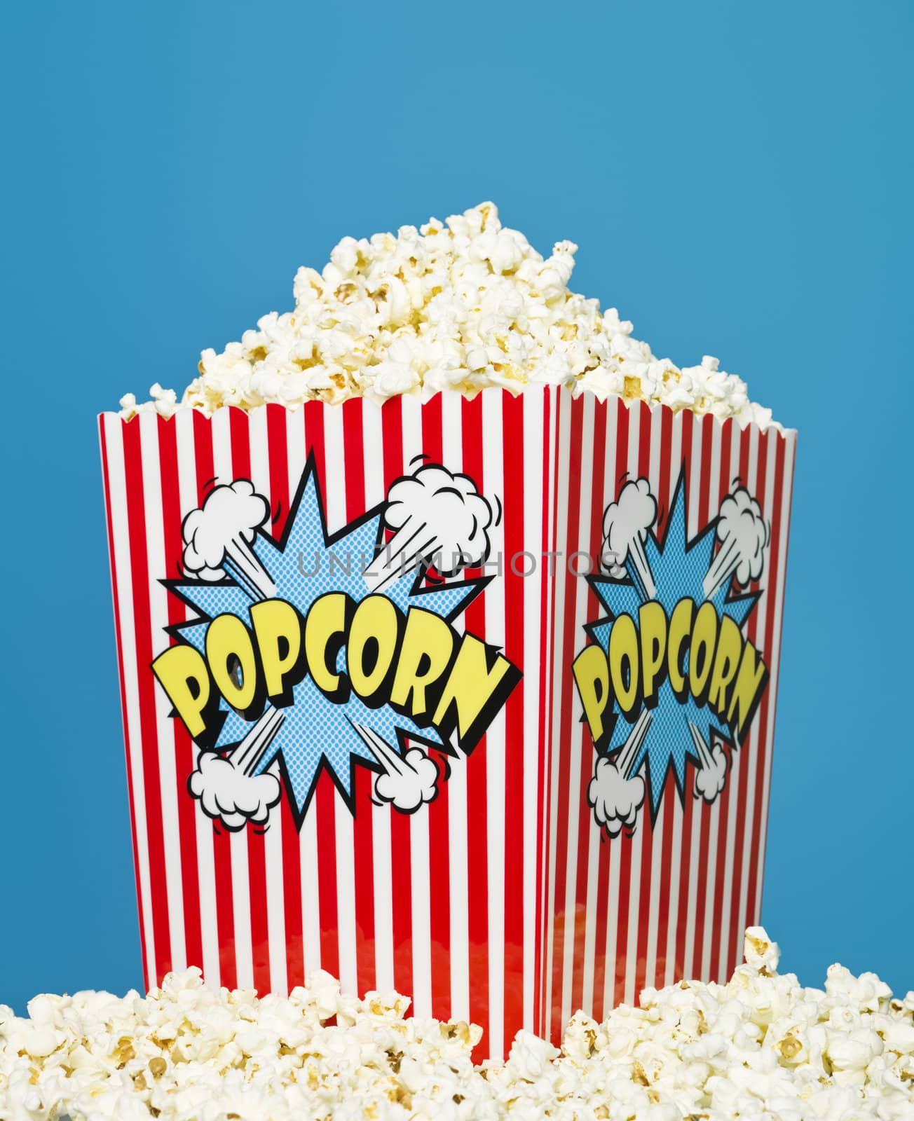 Basket of Popcorn on blue background
