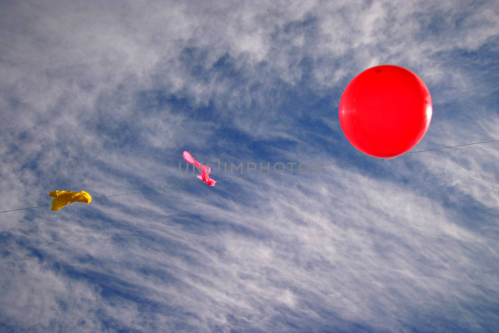 pink balloon over blue sky