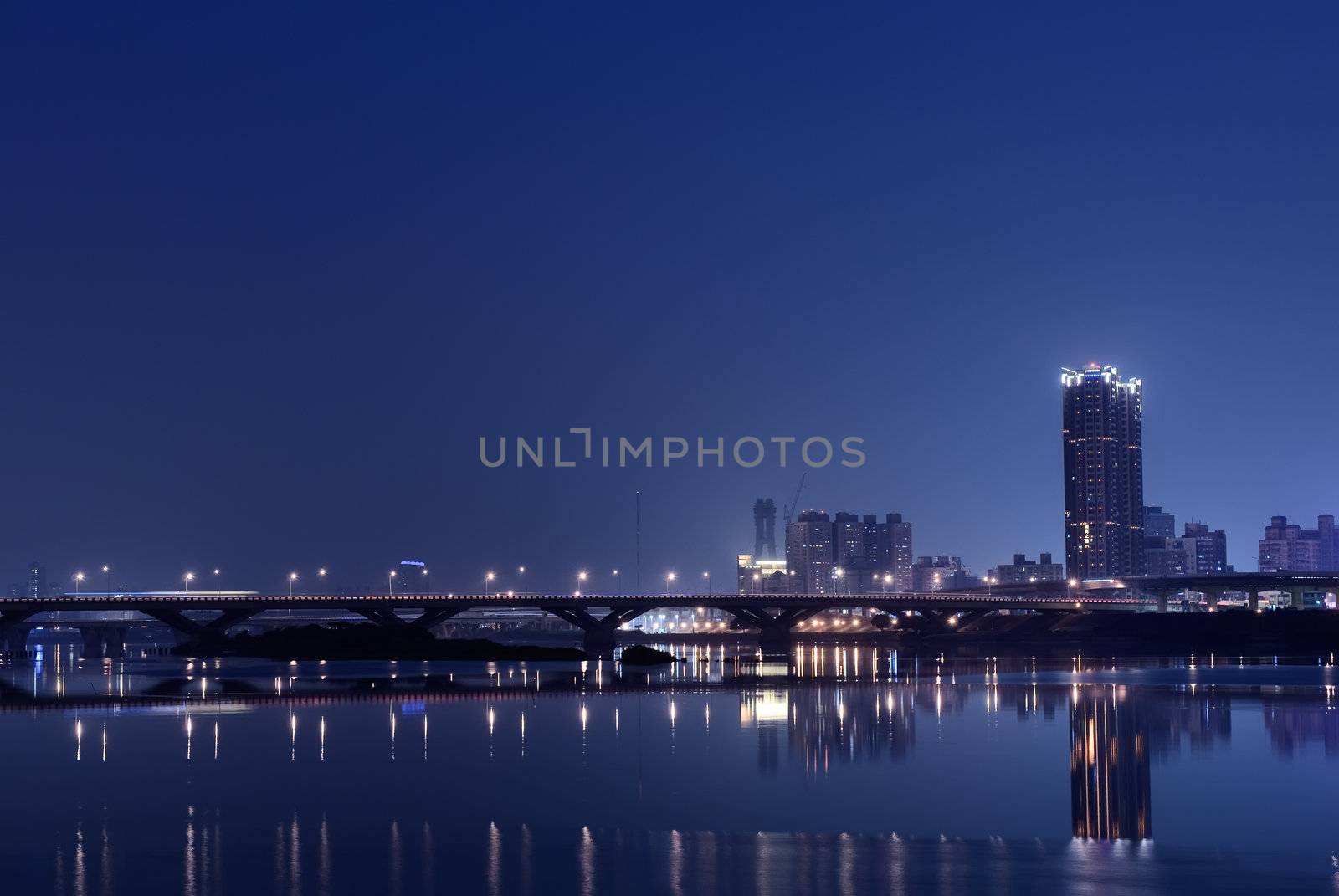 It is a lonely blue and purple city night.