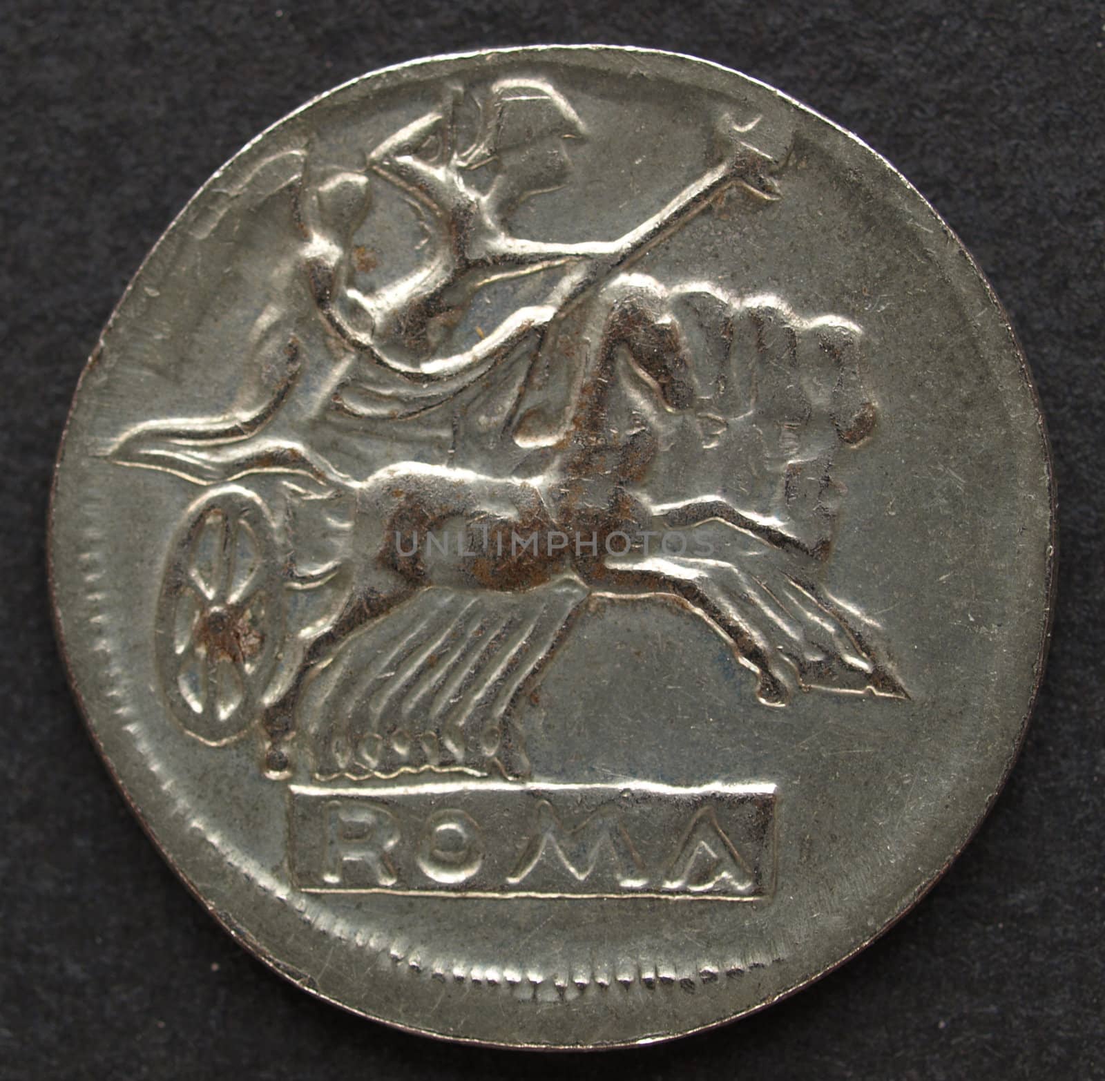 Ancient Roman coin on a black background