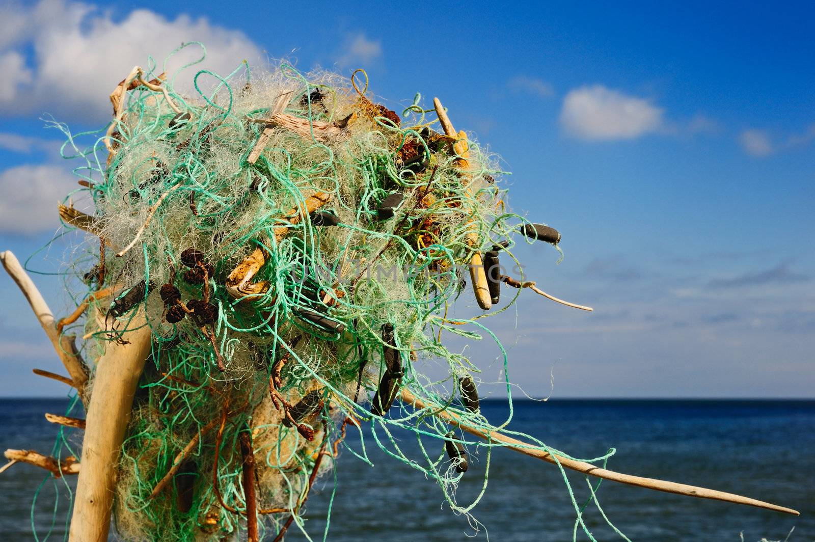 Tangled fishing nets on the sea shore