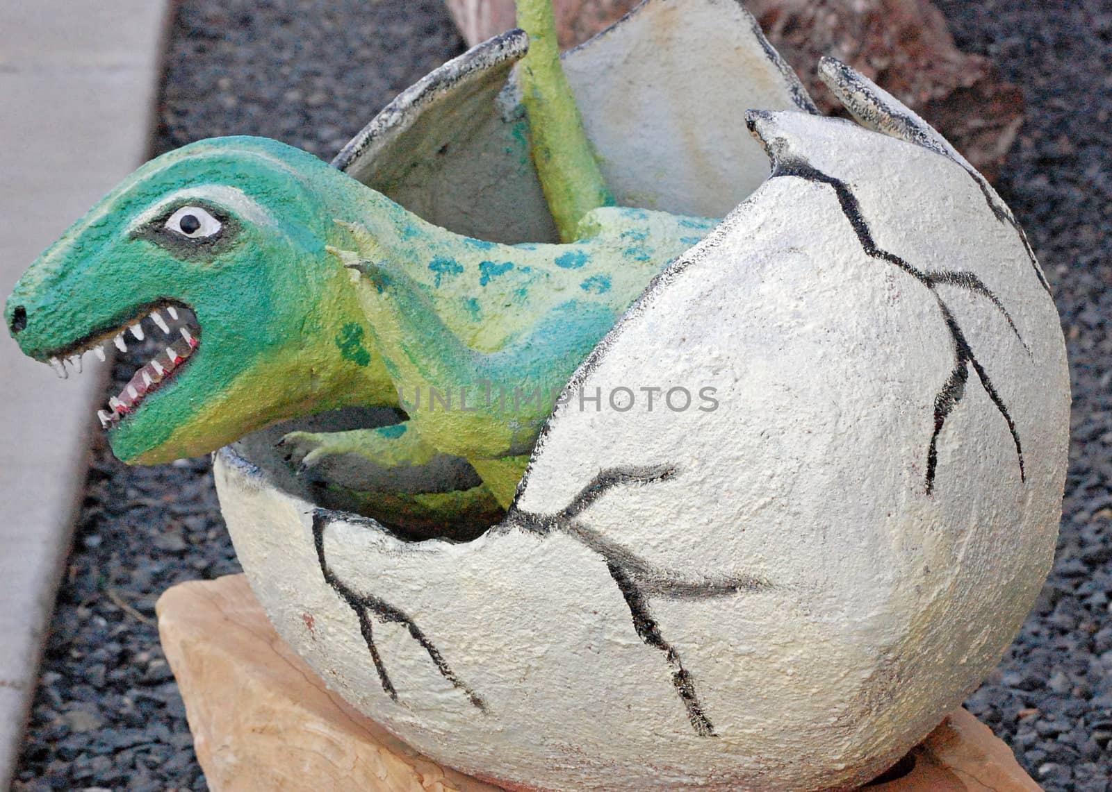 Dinosaur hatching out of egg