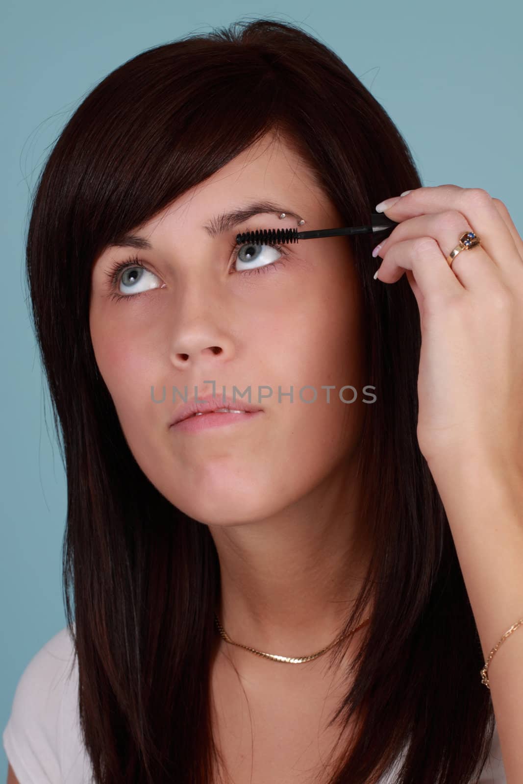 girl applying makeup by lanalanglois