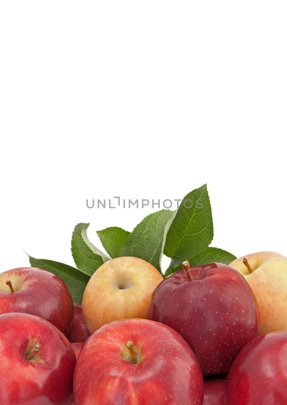 Variety of apples with green leaves, isolated on white background.