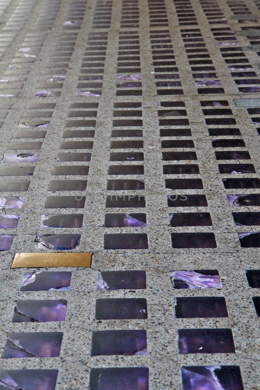City sidewalk with imbedded purple glass sklights