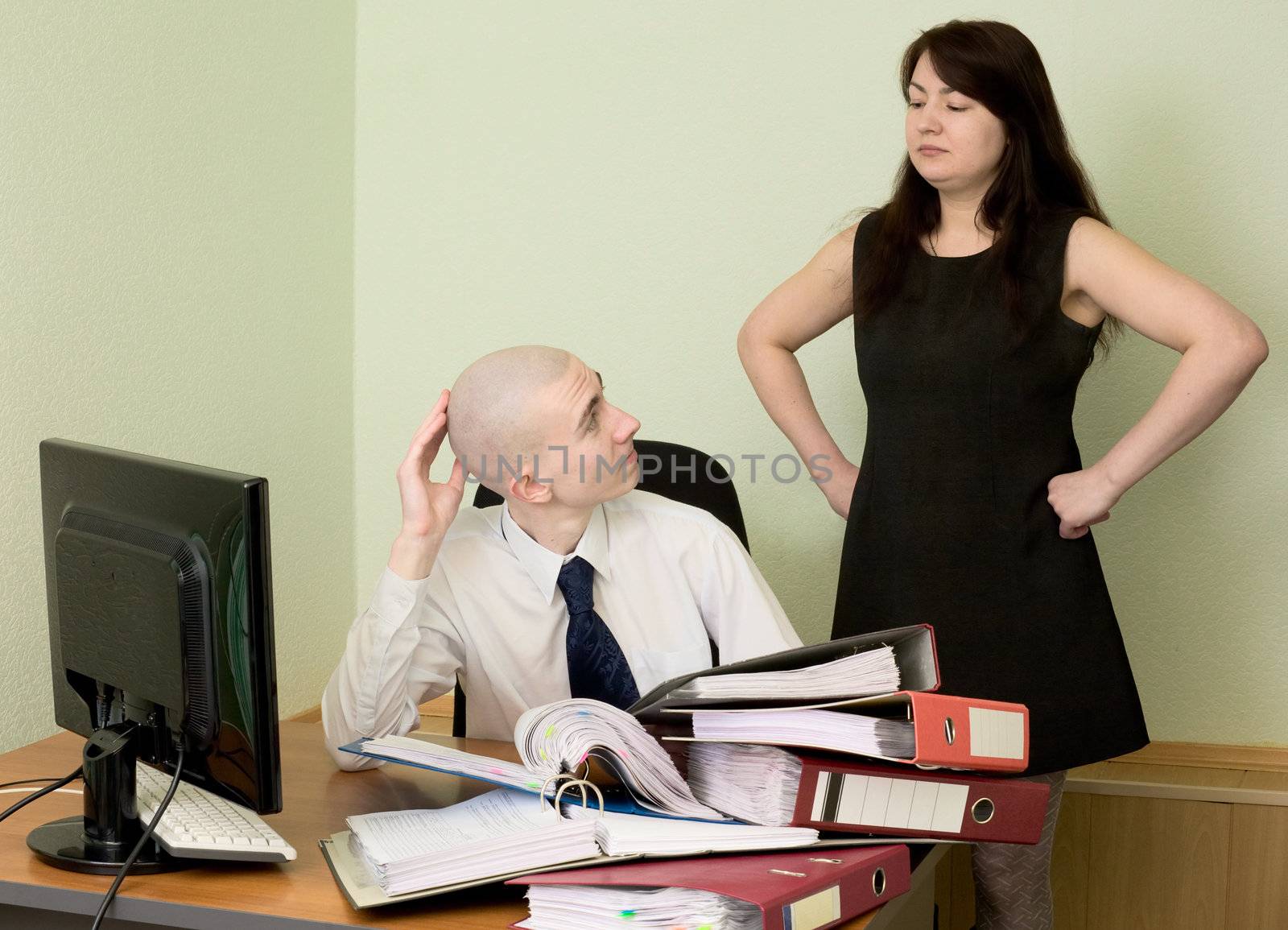 The bookkeeper and the secretary on a workplace at office