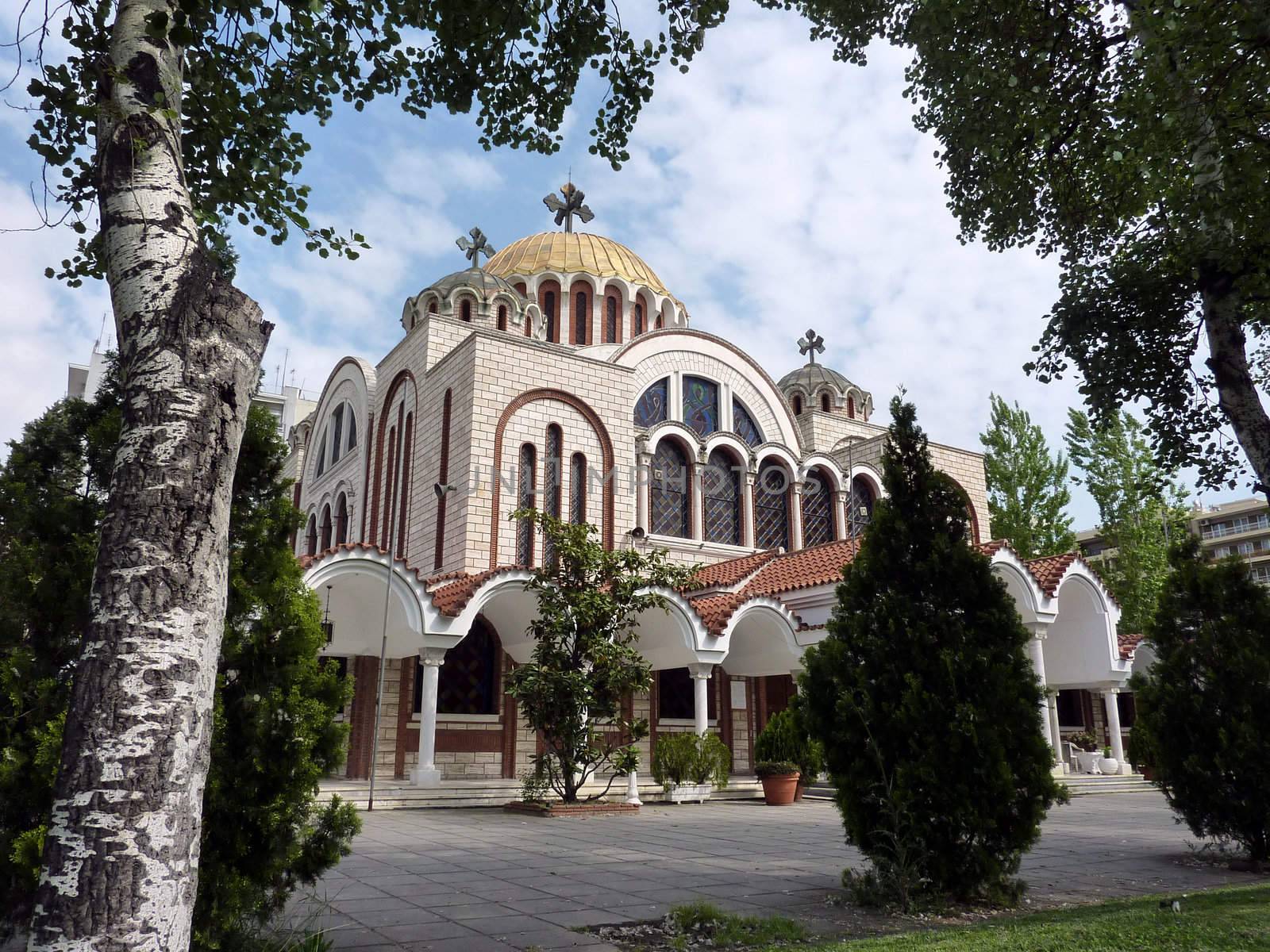 Church of Saints Cyril and Methodius in Thessaloniki, Greece, surrounded by trees by beautiful weather