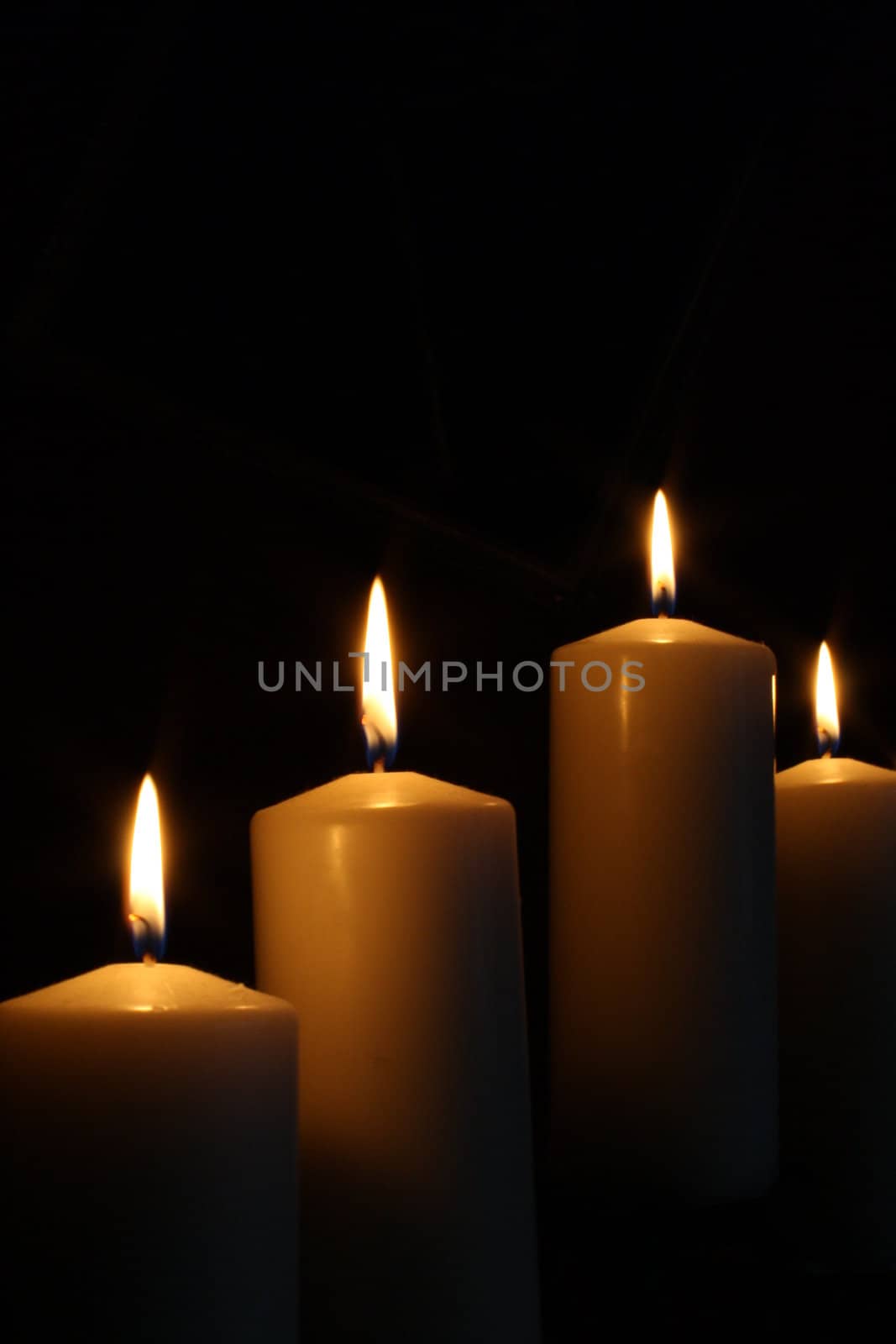 A candlestick with four candles.