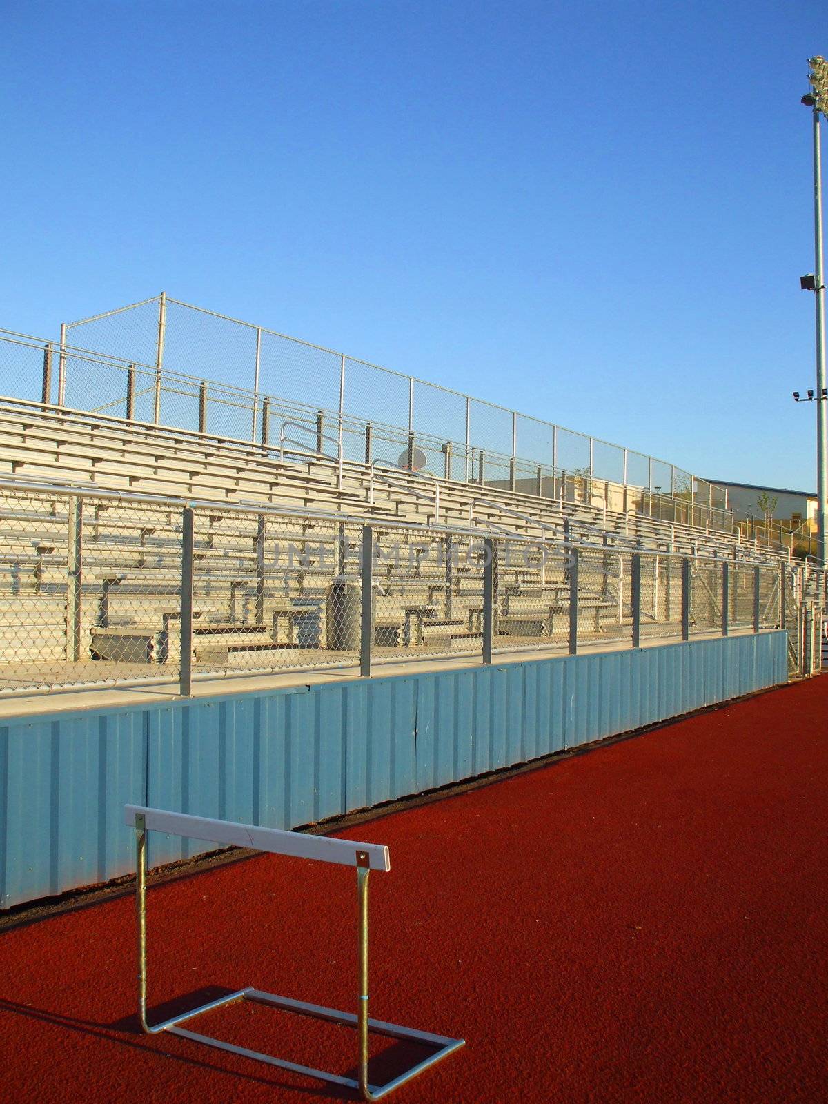 Empty bleachers on a stadium in a park.