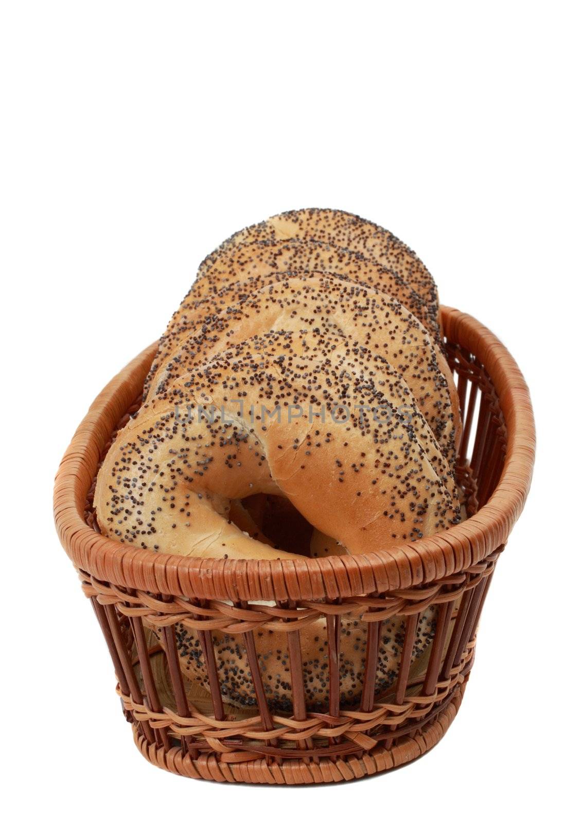 poppy seeds bagels in a basket isolated on white