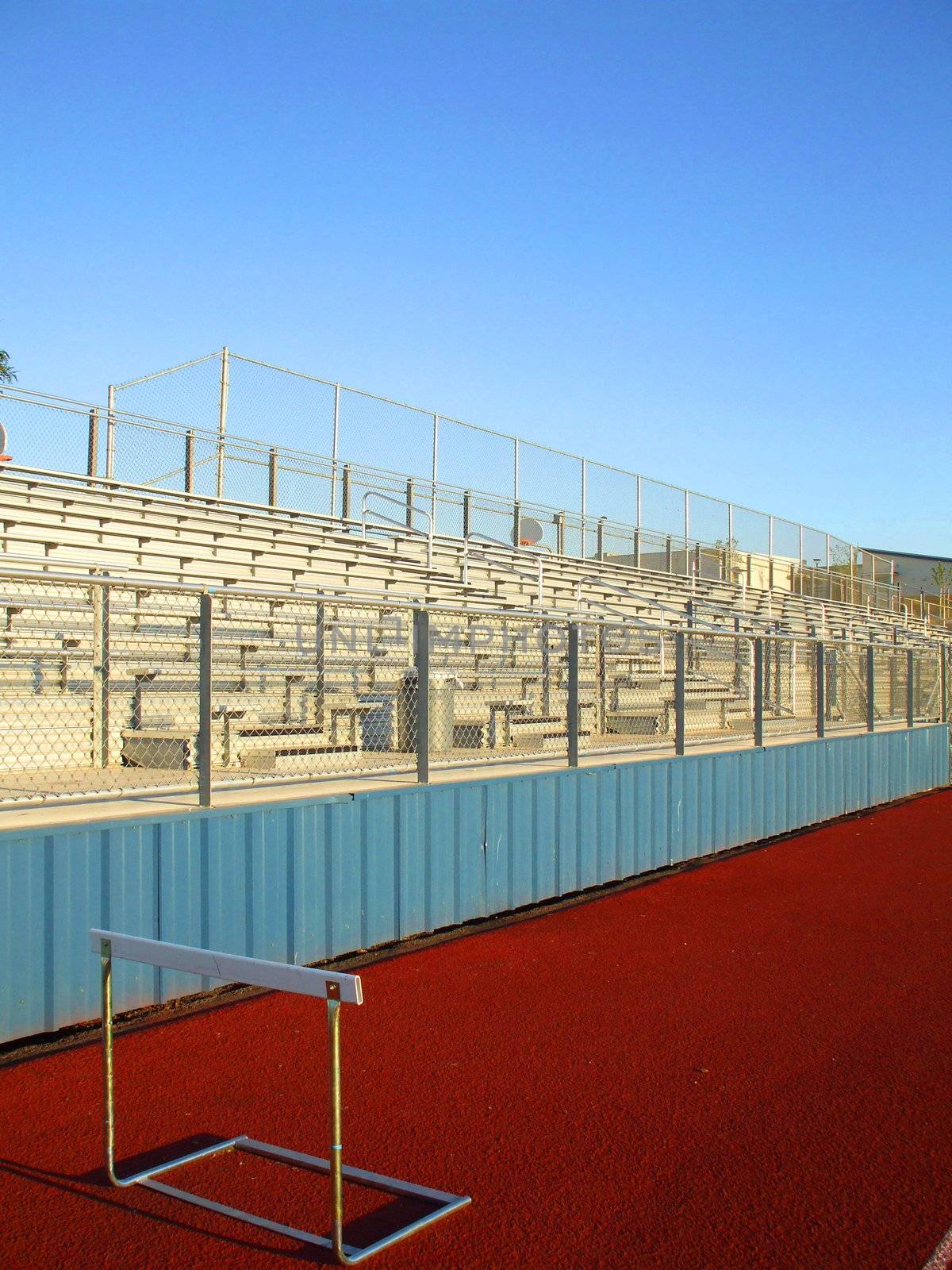 Empty bleachers on a stadium in a park.