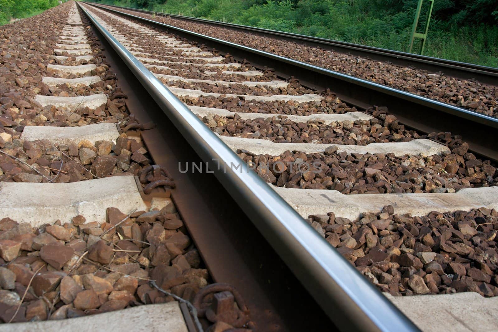 Closeup of straight railway tracks from low angle