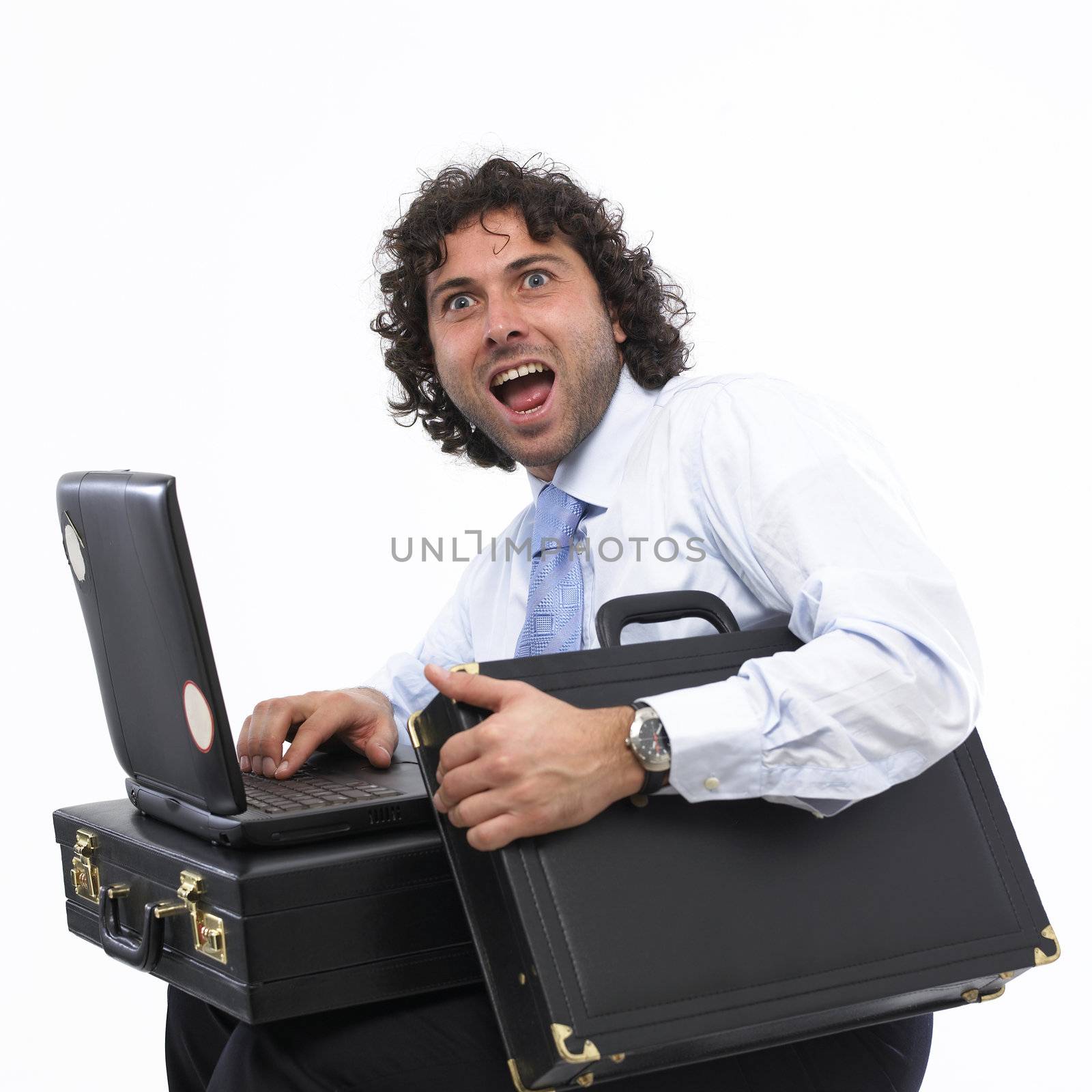 happy businessman with laptop and briefcase