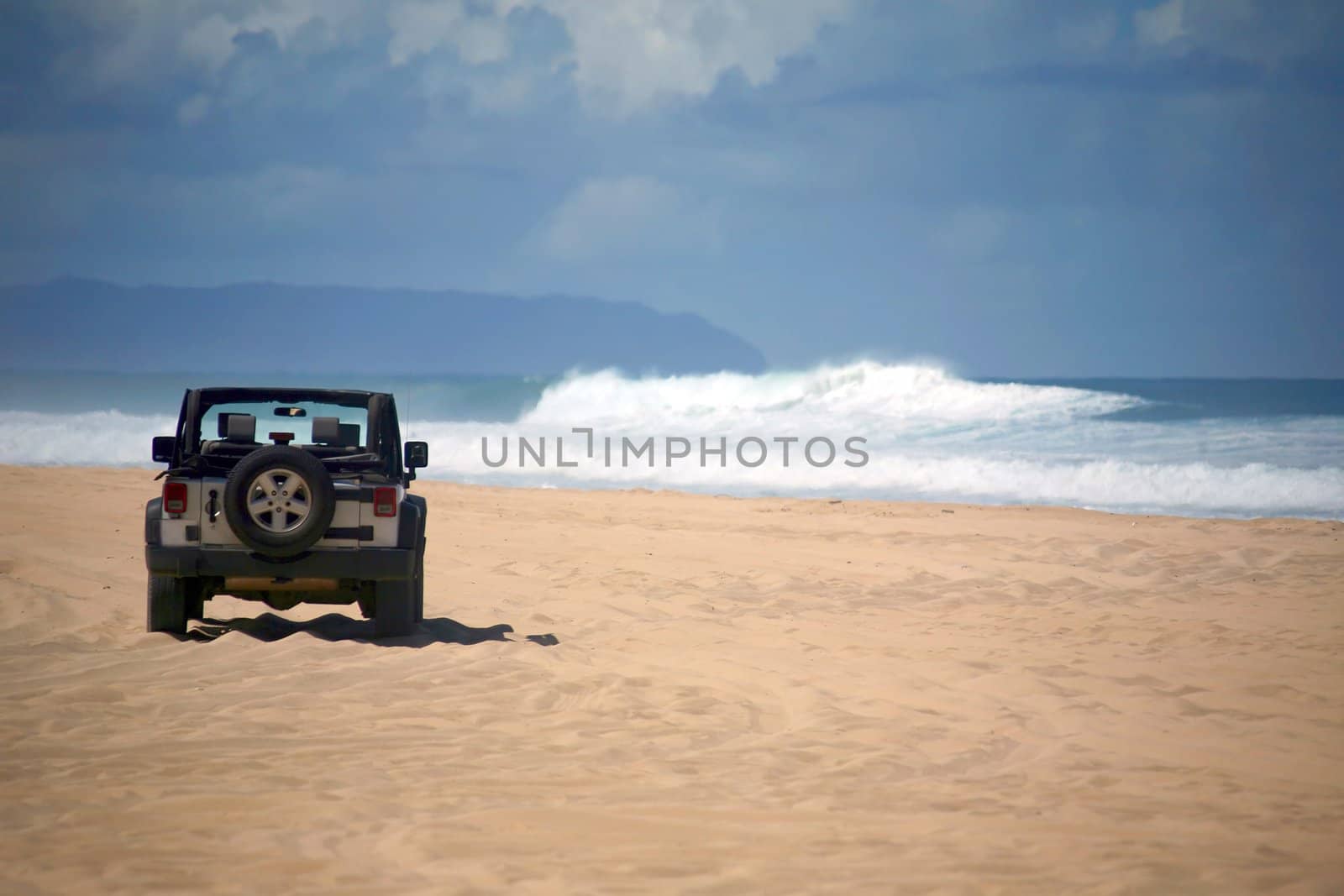 Offroad Vehicle on sand at a Remote Beach in Hawaii