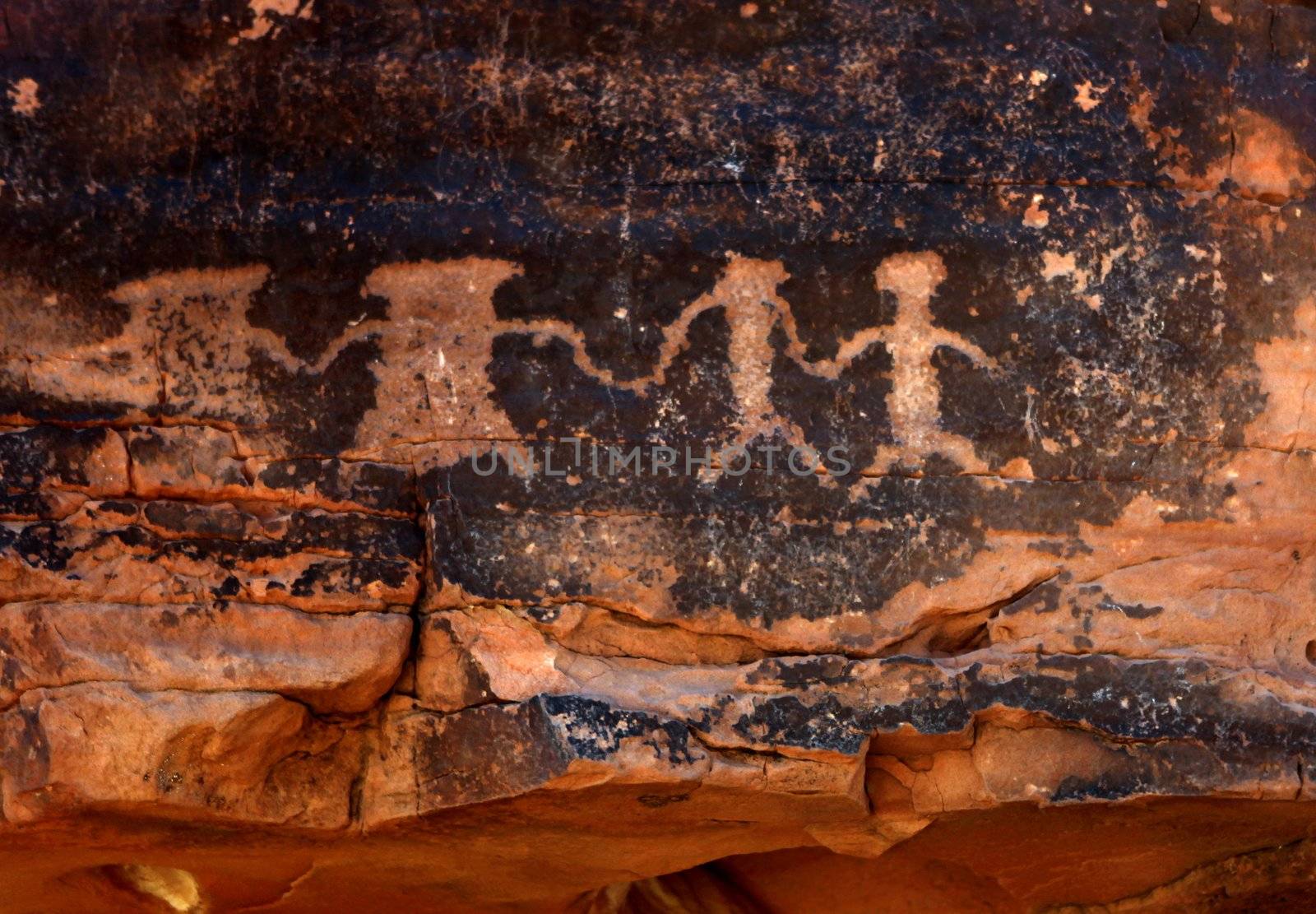 Native American Petroglyphs in Red Sandstone From the Southwestern Desert