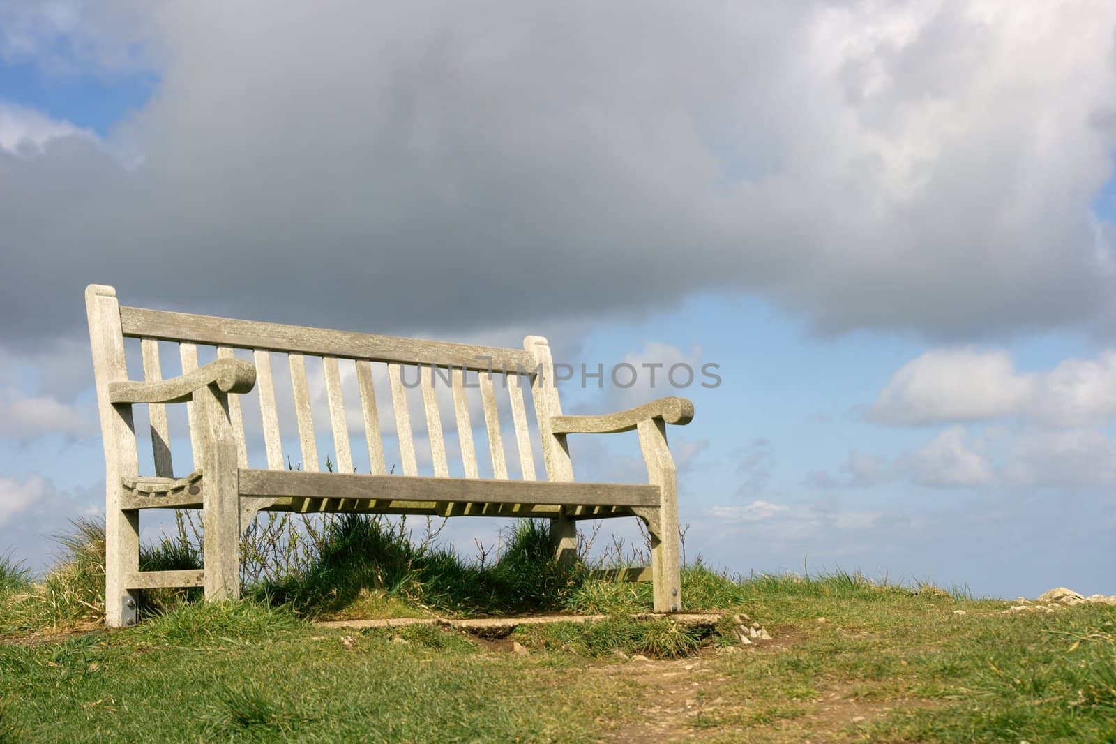 Bench on a hilltop, storm is coming, it's about to rain