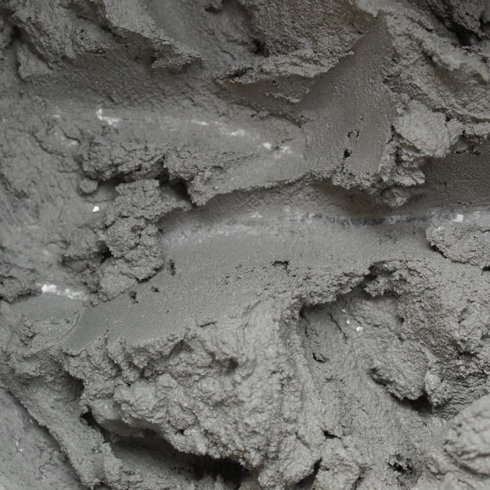 Detail of liquid concrete formed by mixed cement, water and sand