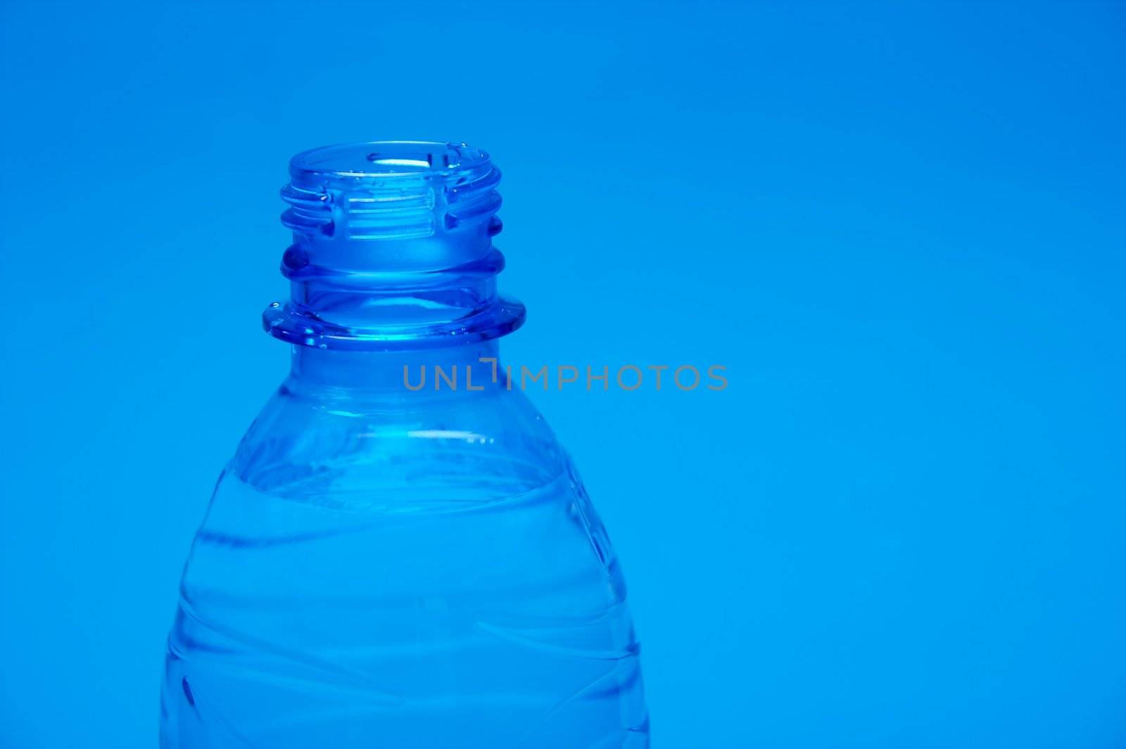 Closeup of the top part of a plastic bottle