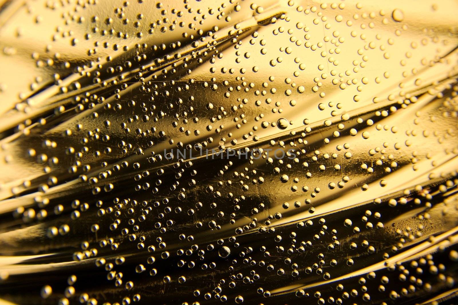 Closeup of small bubbles on golden background