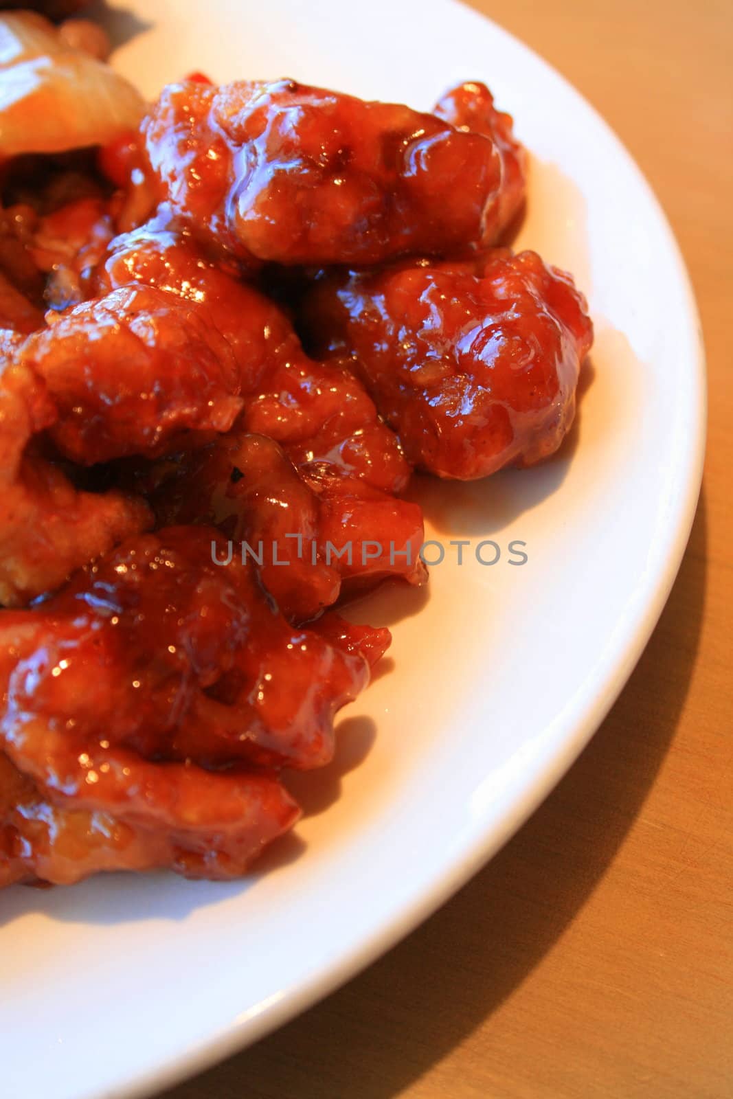 Close up of a sweet and sour chicken.