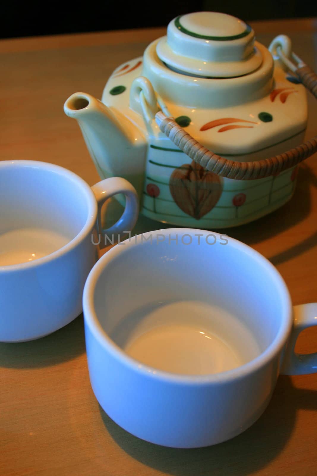 Close up of the teapot and two cups.