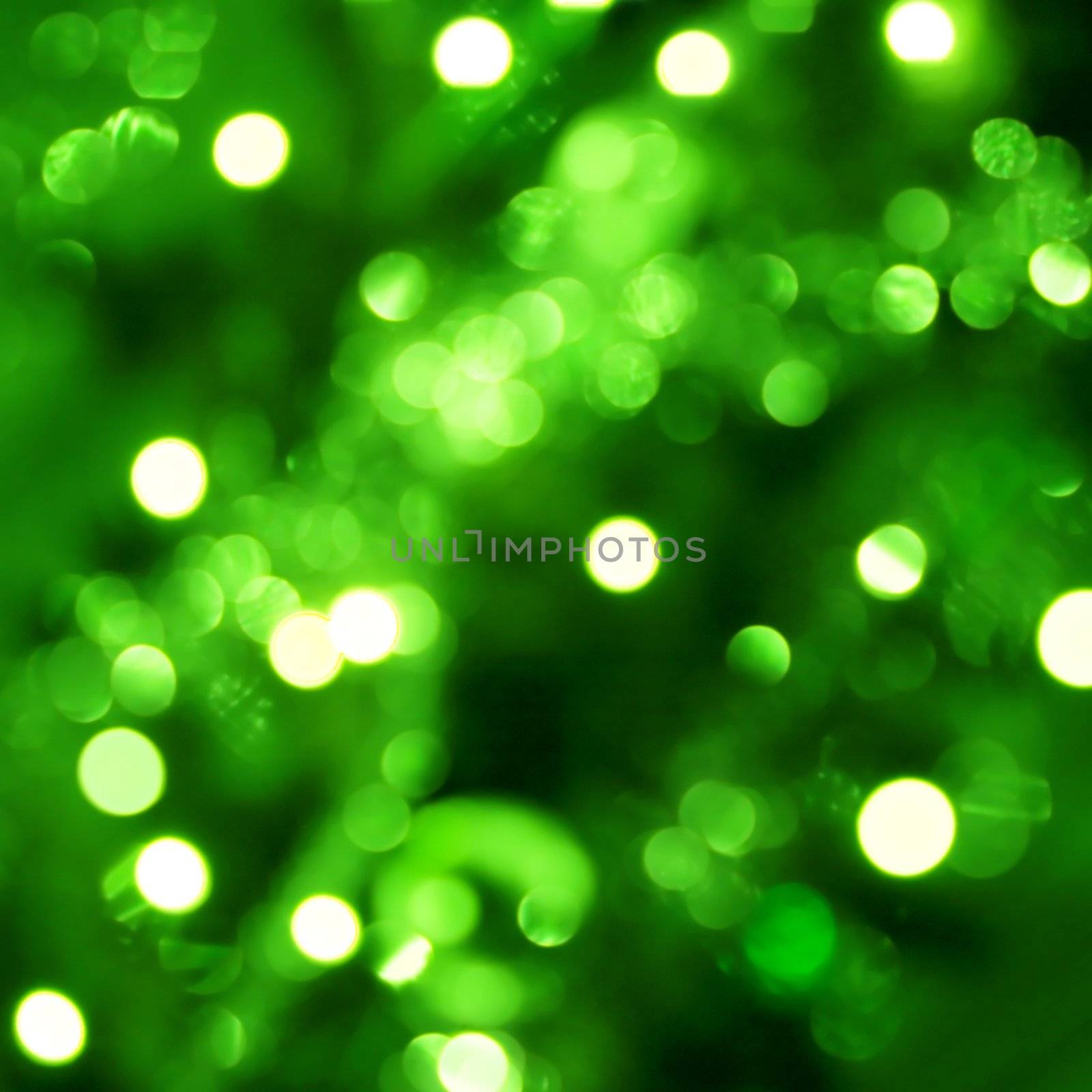 Background with out of focus light dots in green