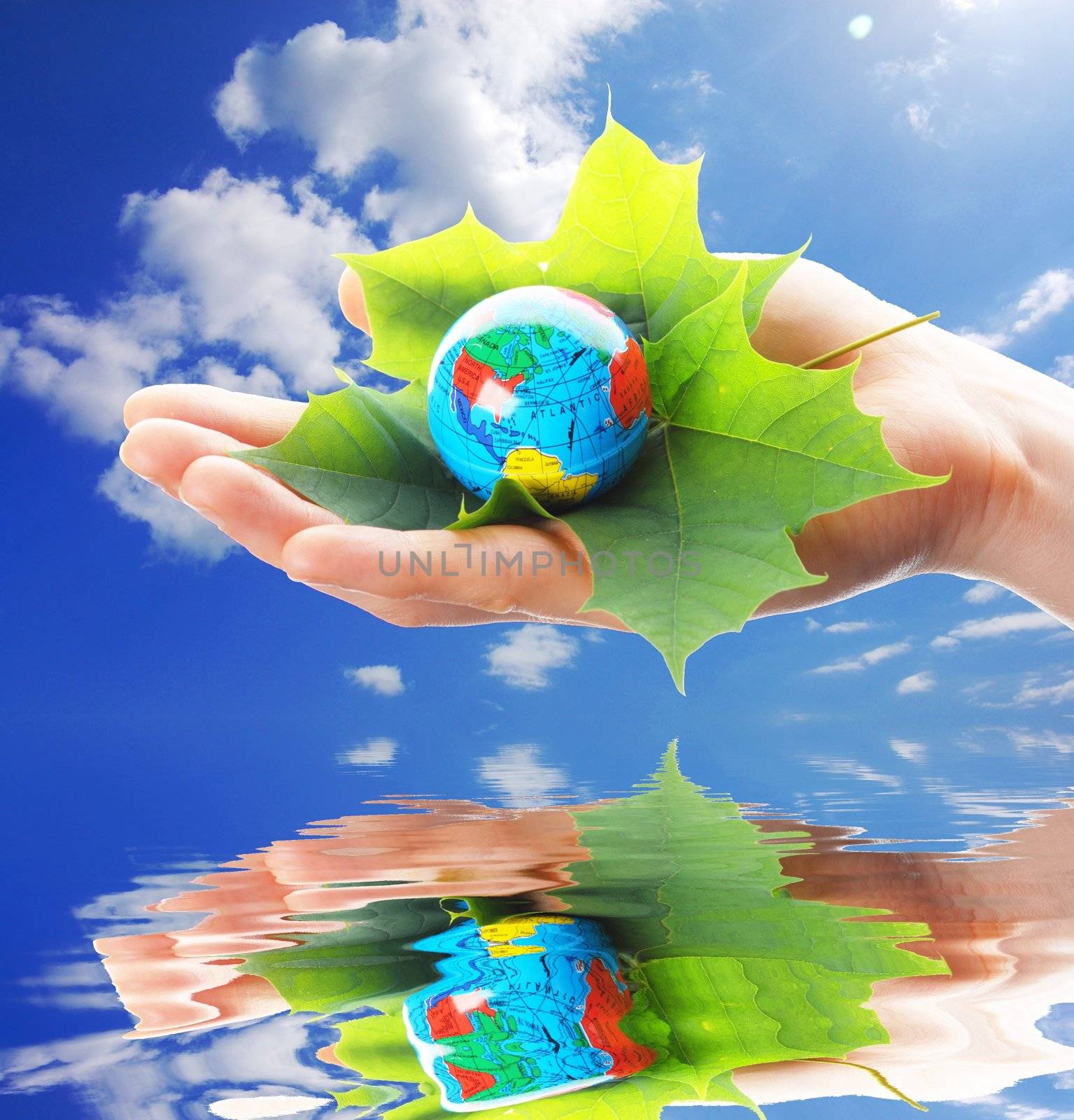 hand and globe showing nature or eco concept