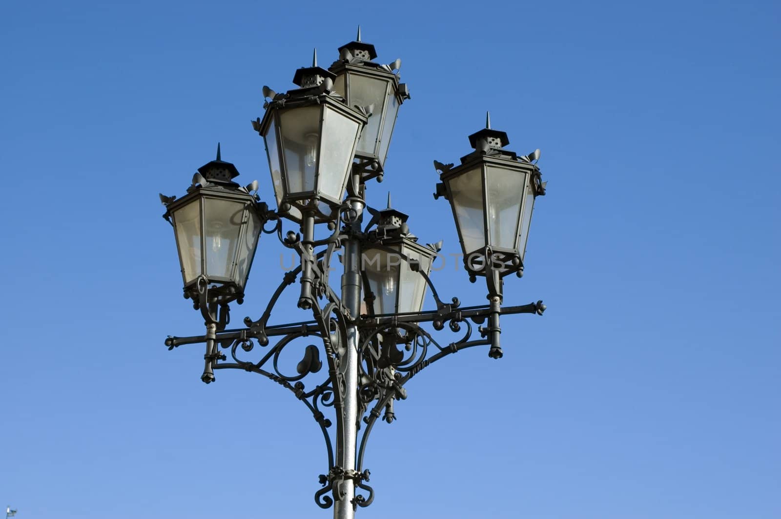 Poland, Wroclaw city - old style lantern in market square with blue sky as background.