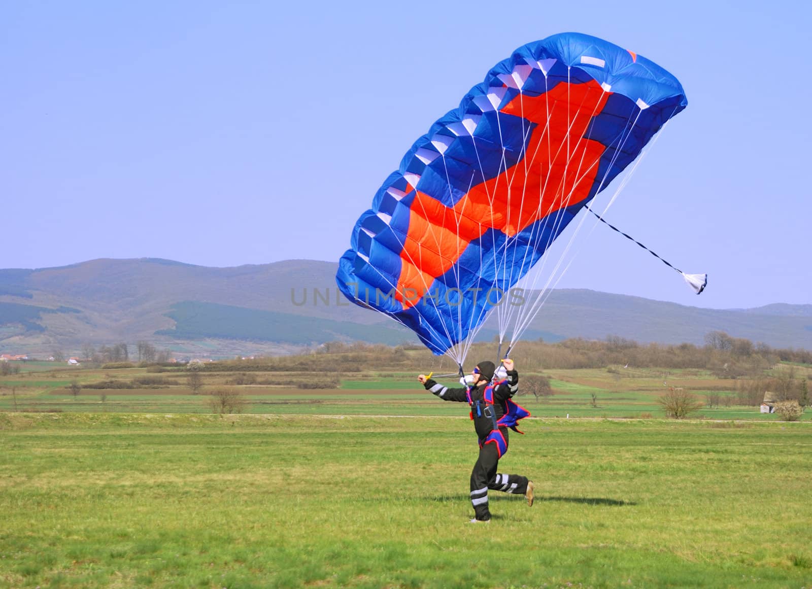 Parachutist running by whitechild