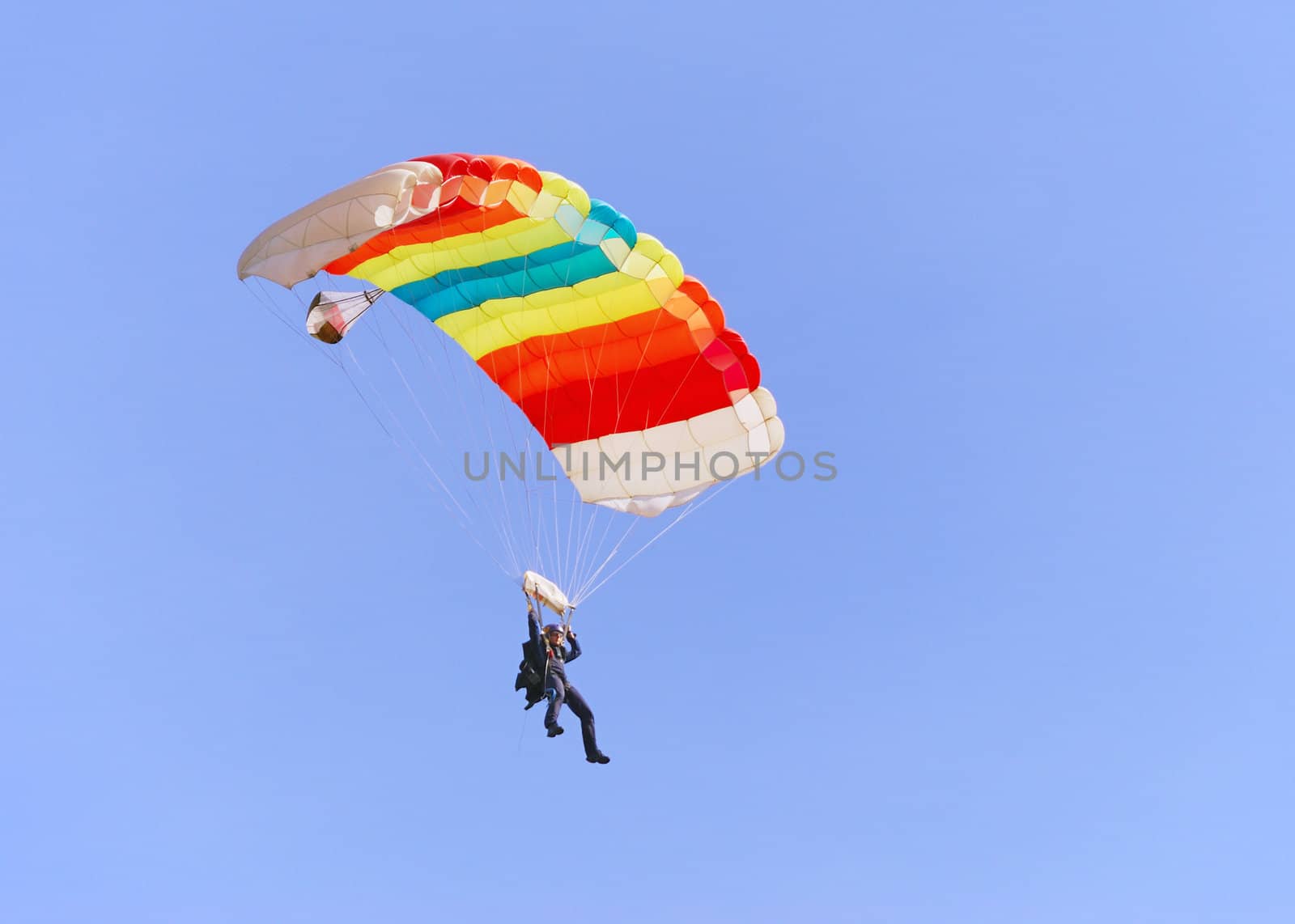 Colorful parachute against clear sky in background.