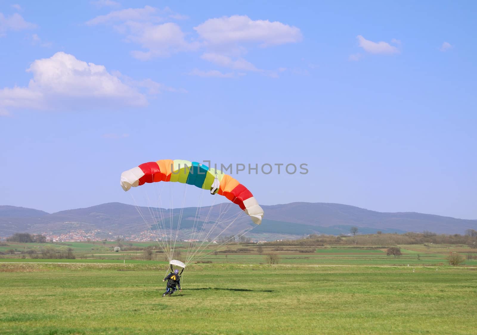 Parachutist landing by whitechild