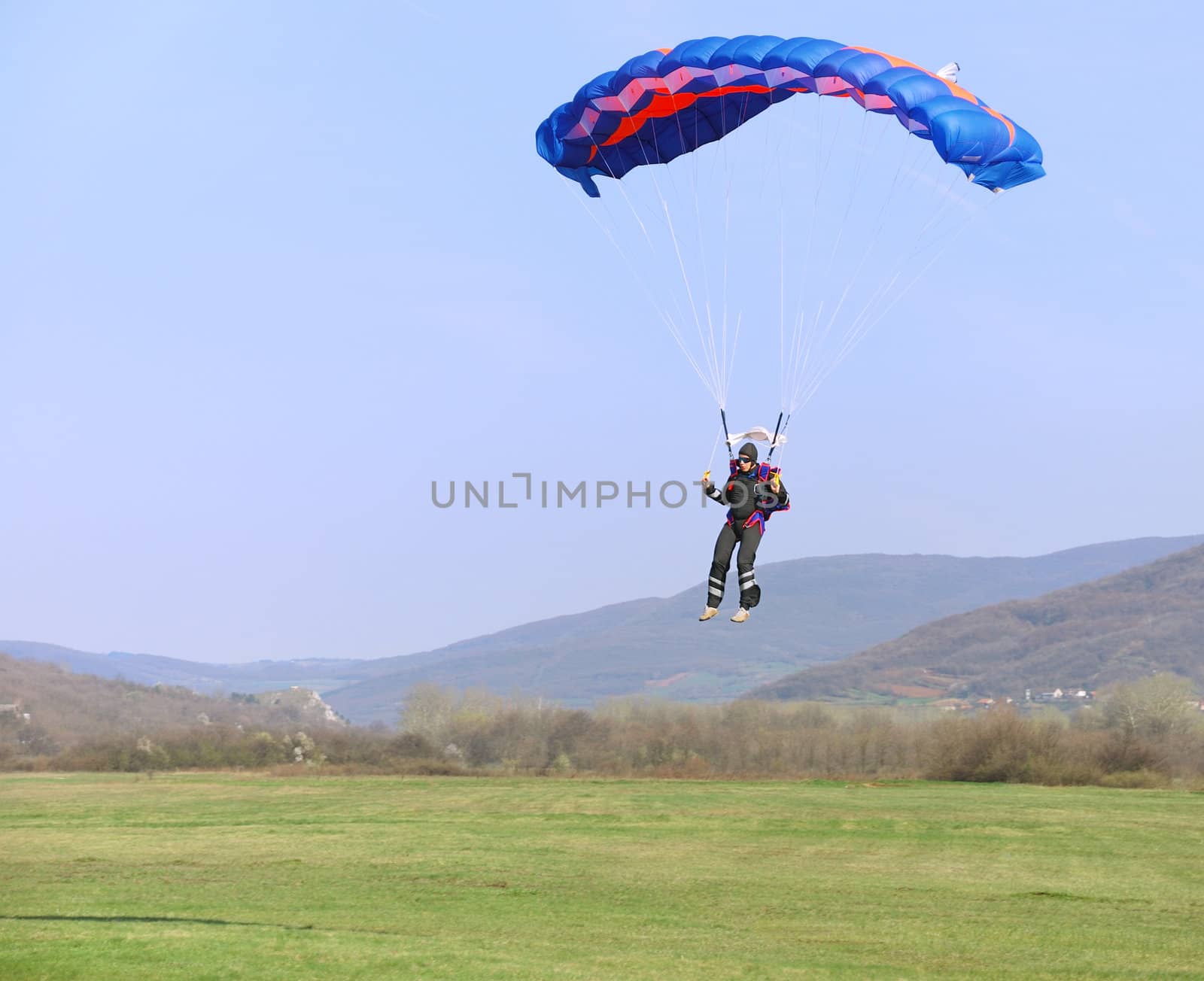 Parachutist landing by whitechild
