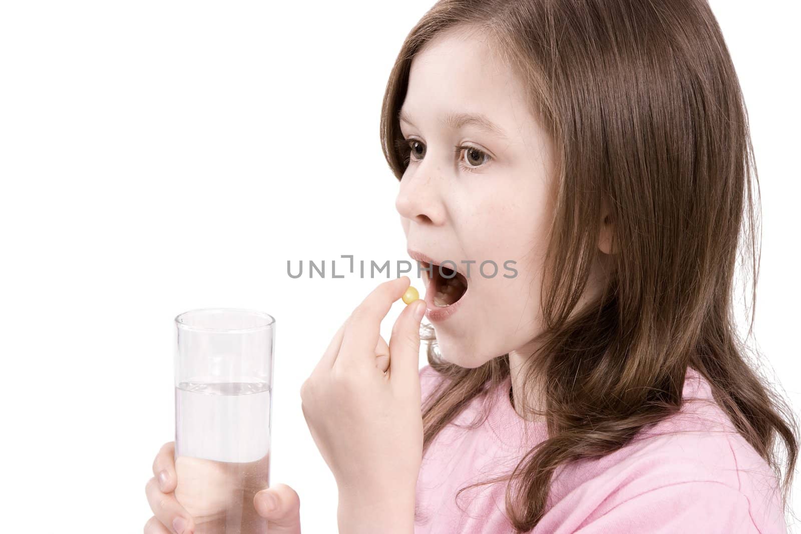 The girl is going to eat a tablet and to wash down with its water