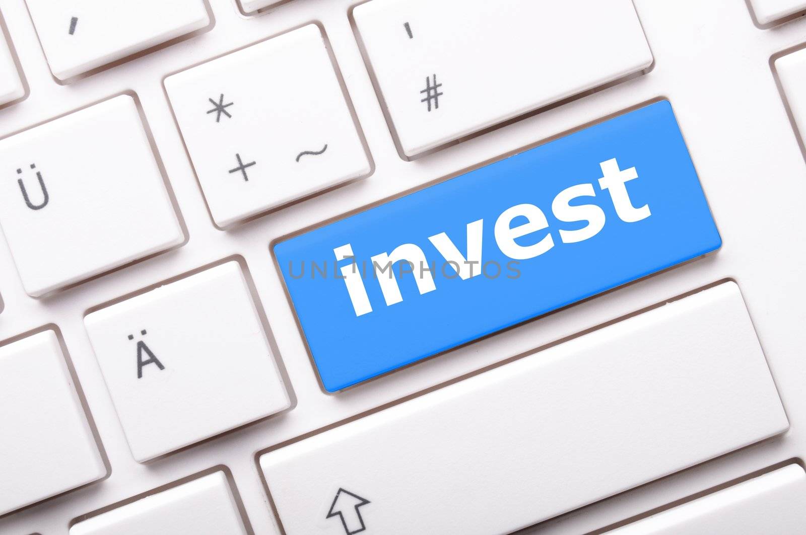 invest key on keyboard showing financial business investment concept