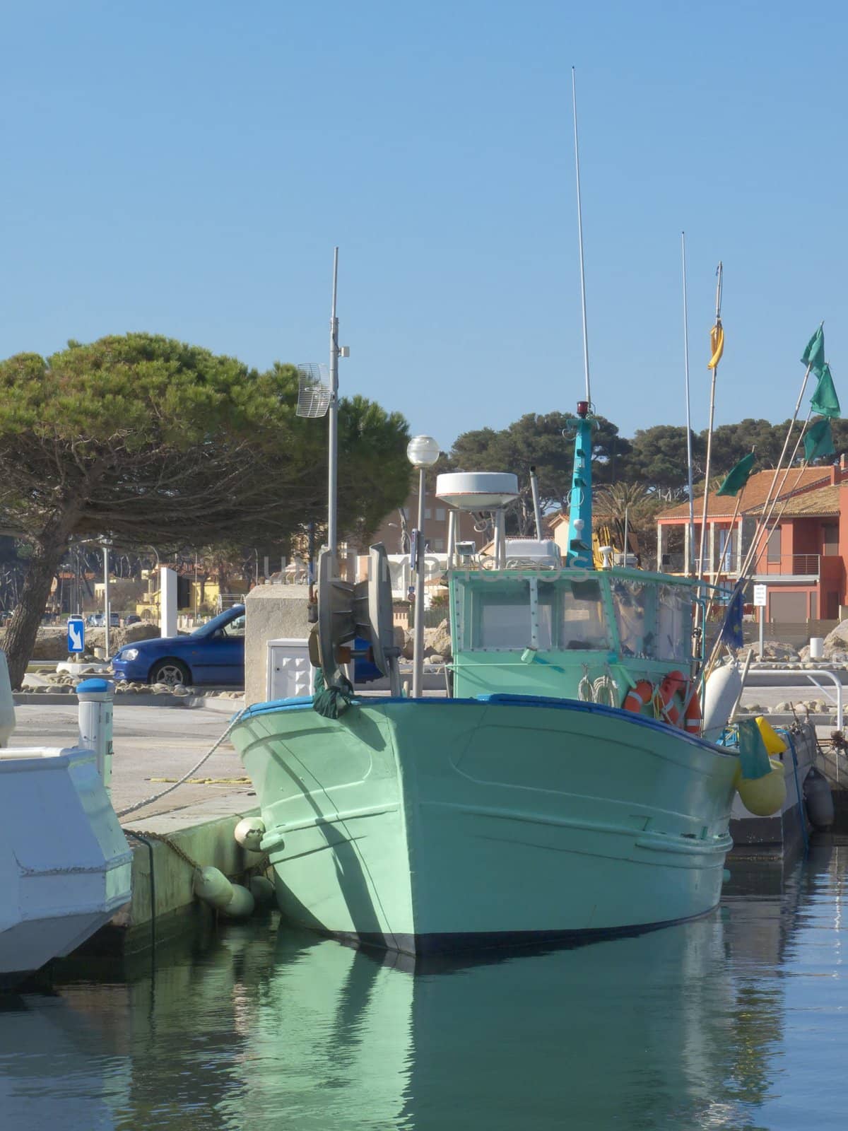 digital image of a green fisher boat in a Mediterranean harbour