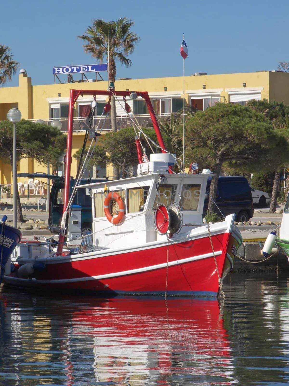 digital image of a red fisher boat at Mediterranean habor