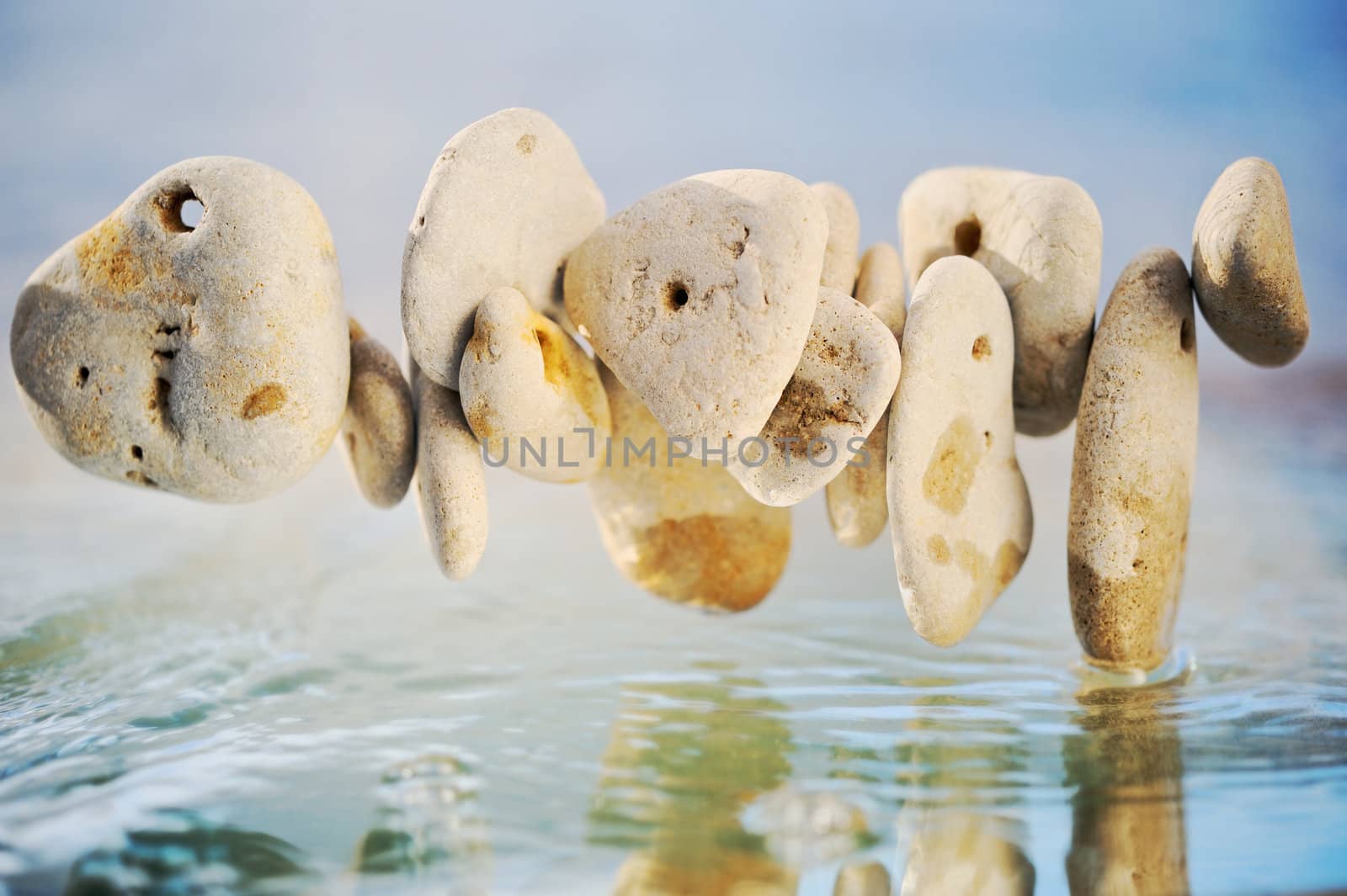 White stones joint chain above the water