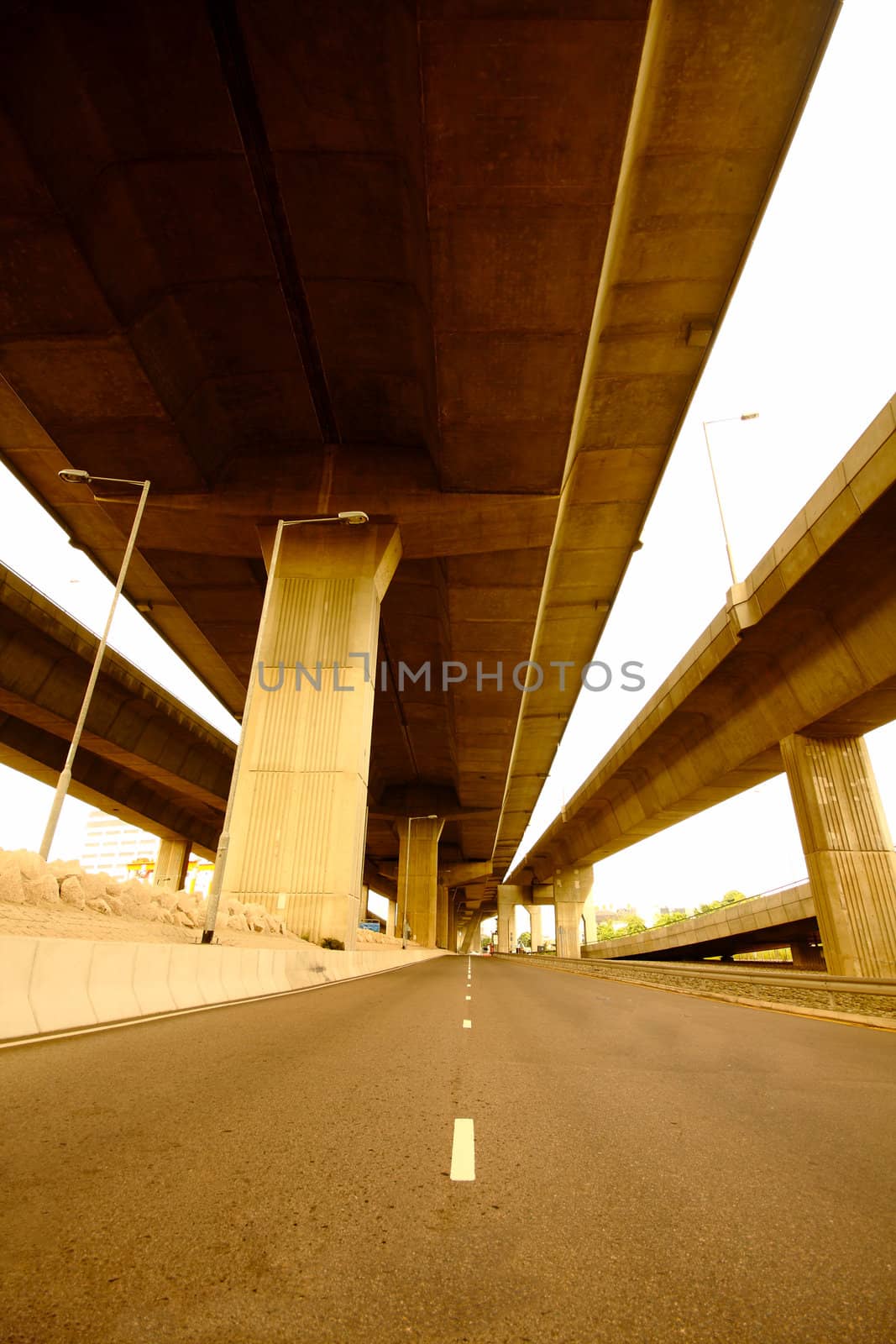 highway under the bridge with yellow toned