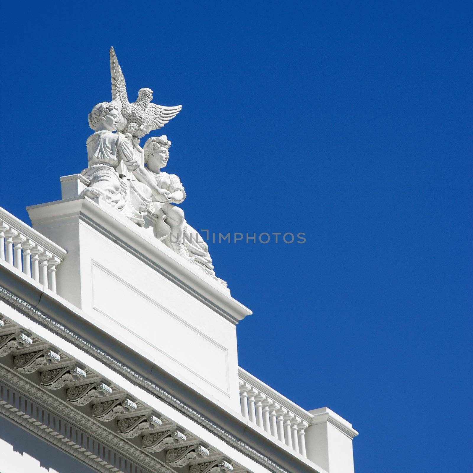 Low angle of statuary on the Sacramento Capitol building, California, USA.