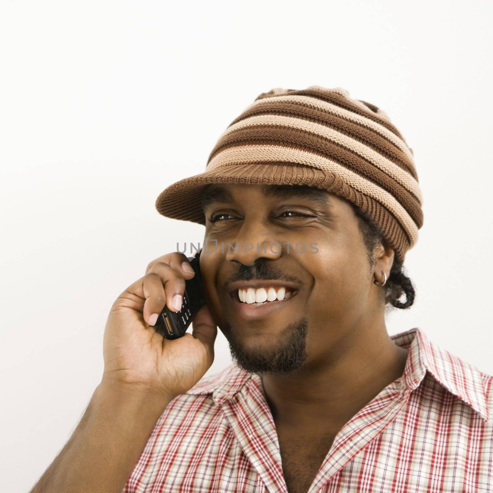 Man talking on phone. by iofoto