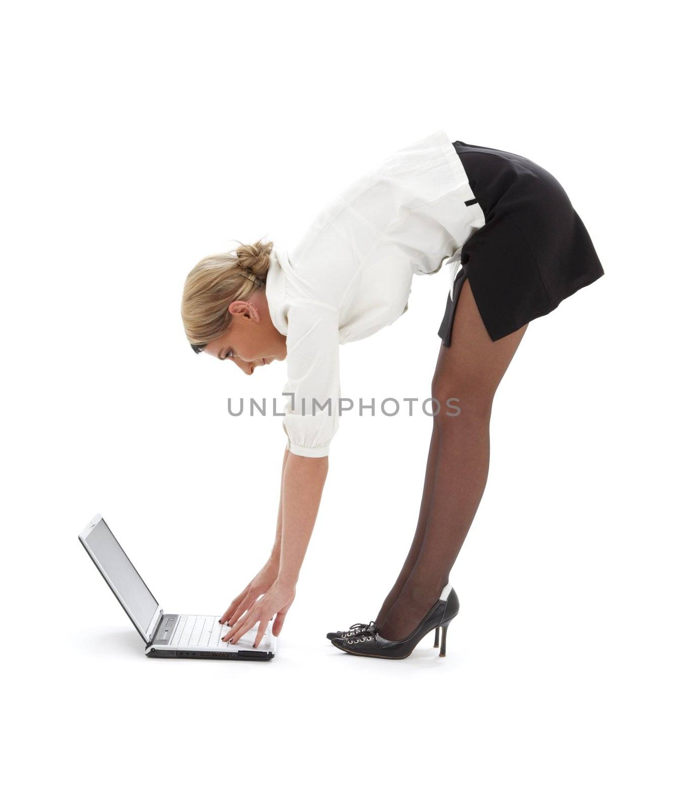 flexible businesswoman with laptop computer over white
