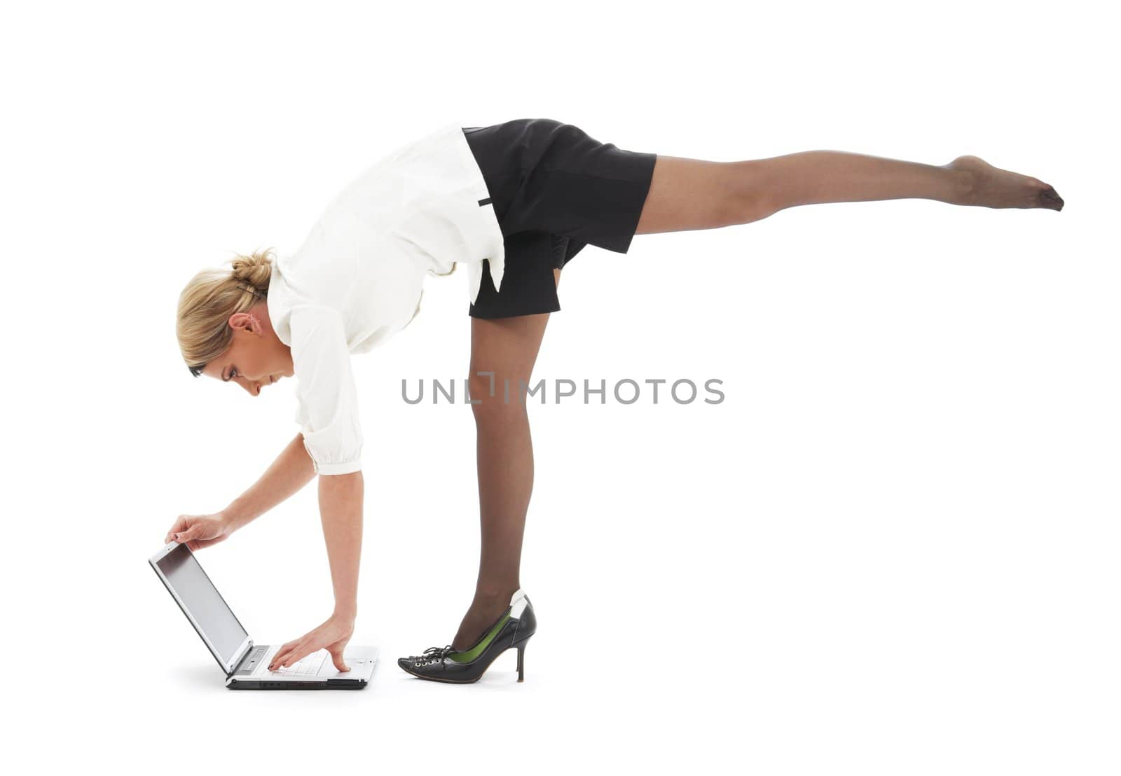 flexible businesswoman with laptop computer over white