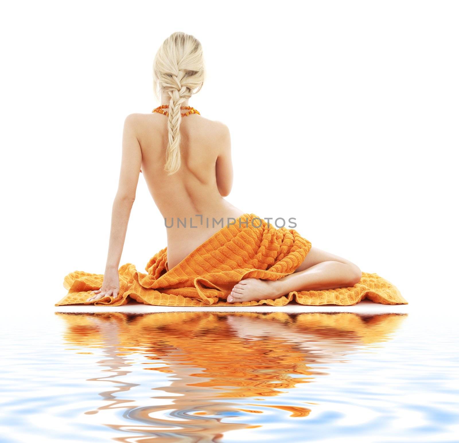 picture of beautiful lady with orange towels on white sand