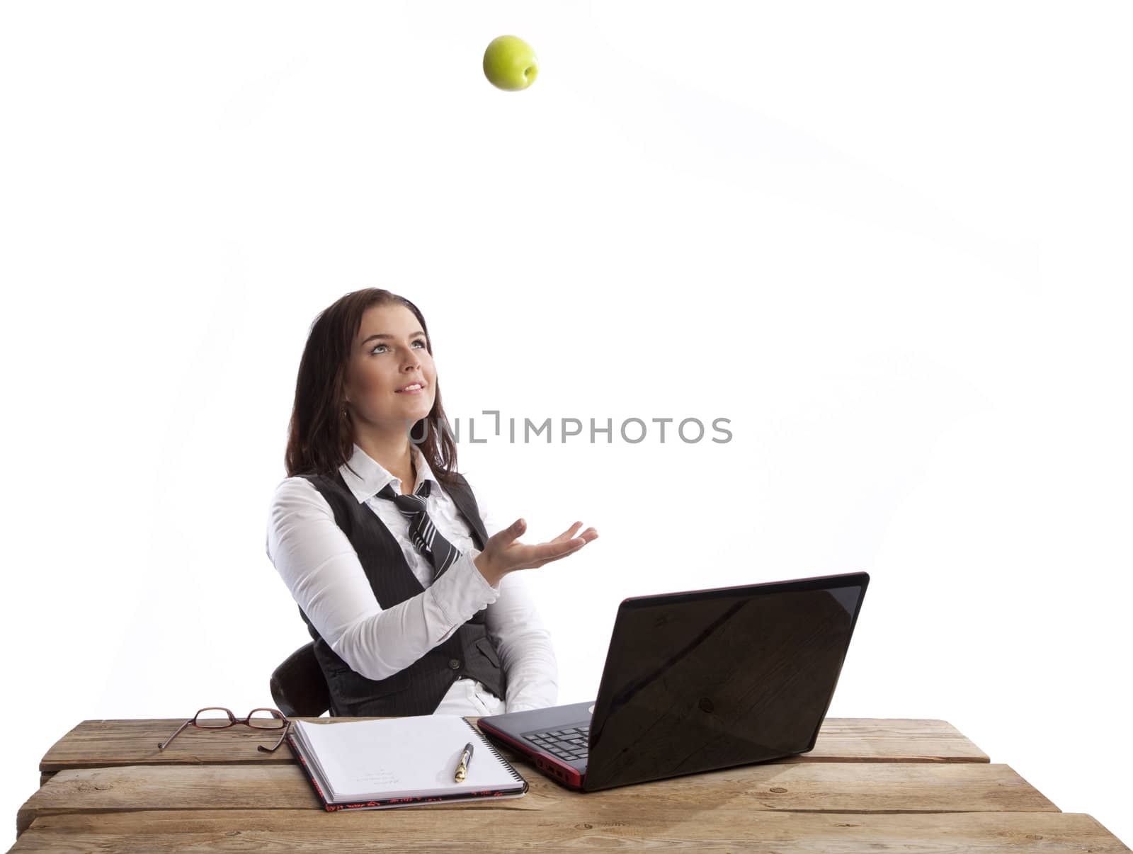 isolated business woman throwing green apple over white background