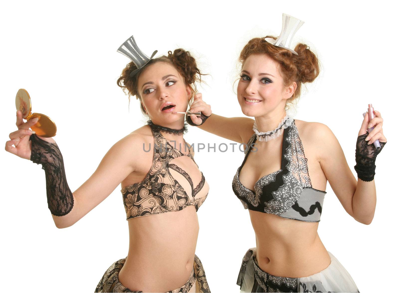 Two girls doing Make Up isolated over white with clipping path