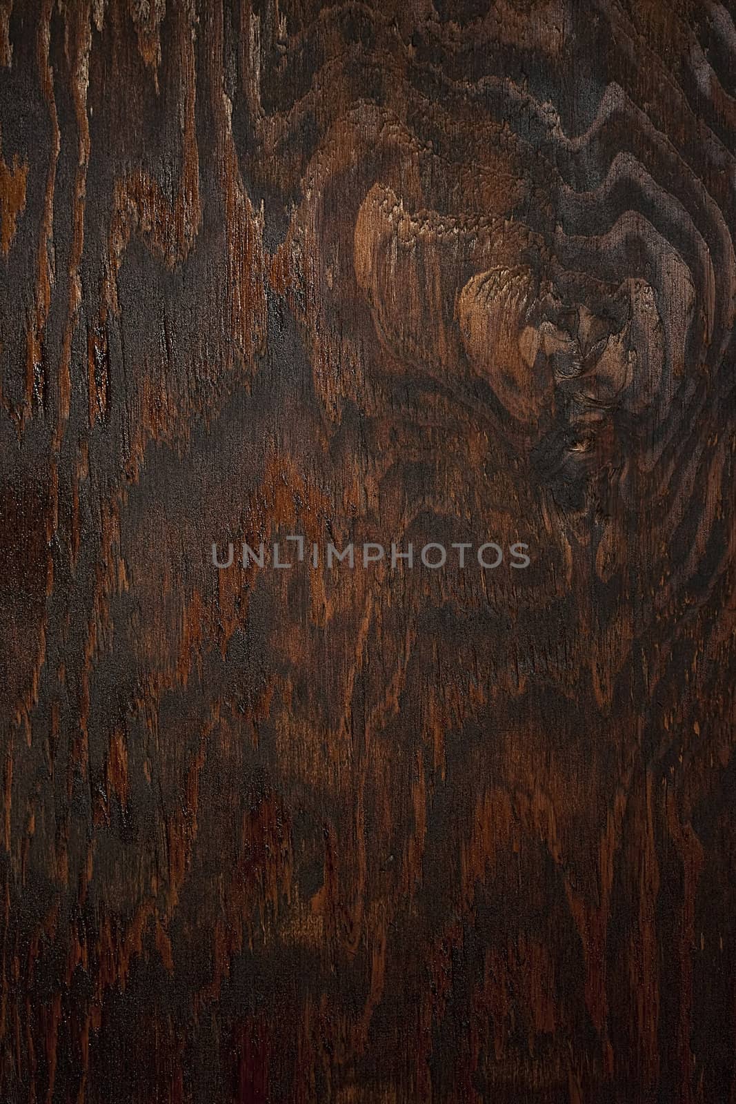 Dark background made of a wood and processed by a special chemical compound.