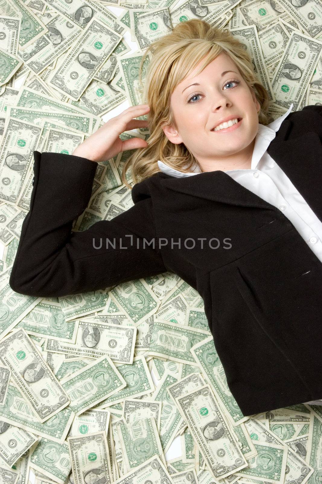 Pretty woman laying in money