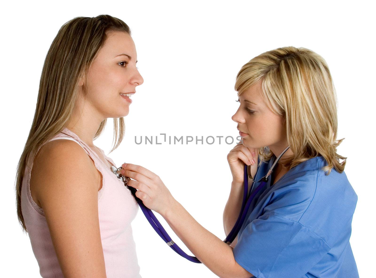 Nurse using stethoscope on patient