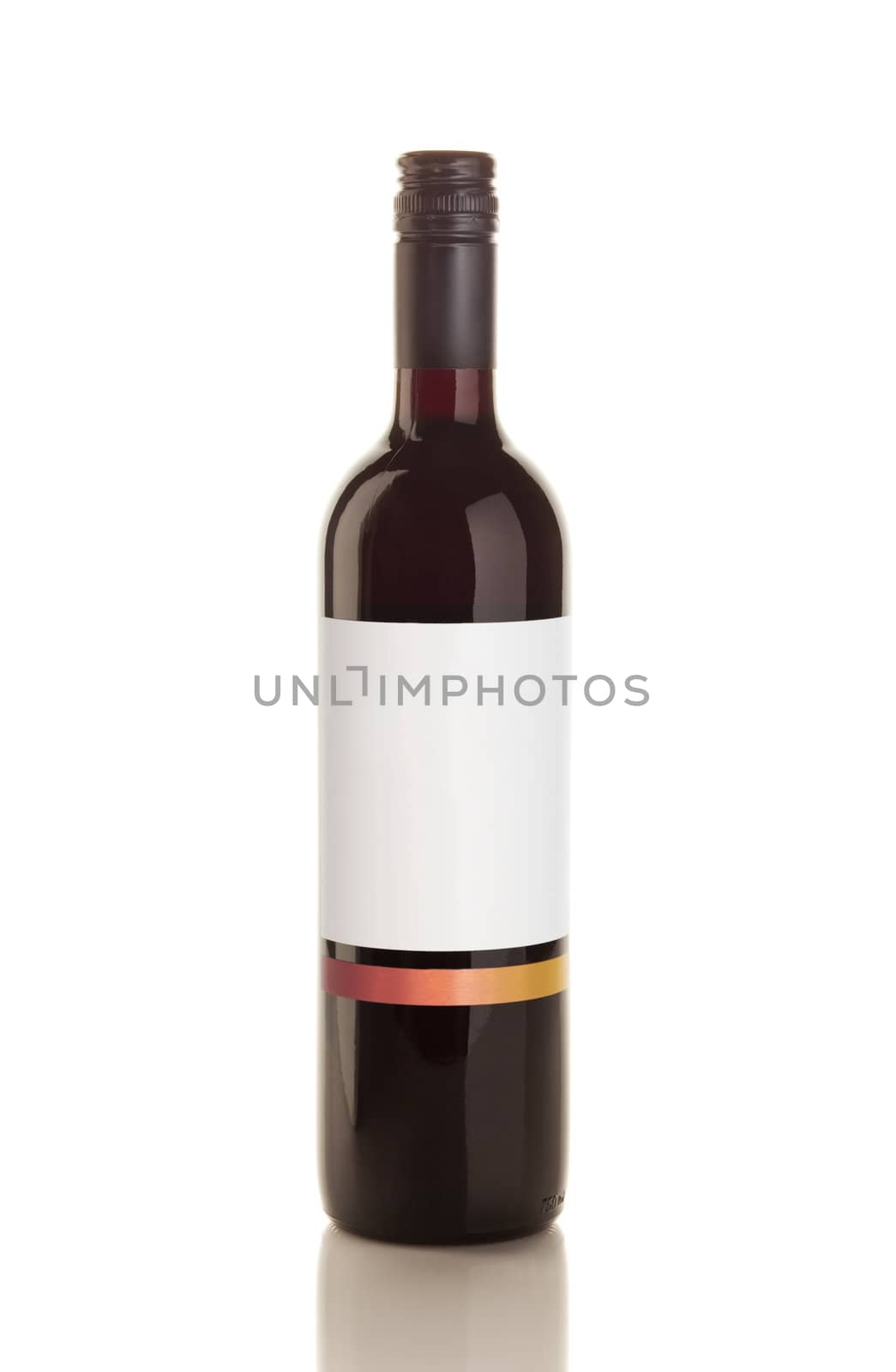 Isolated red wine bottle over a reflective white table